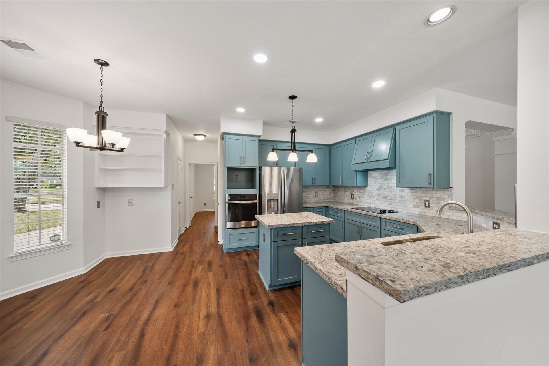 1123 Summer Brook, Sugar Land, TX 77479 Seamlessly connected to the breakfast nook, this kitchen offers a natural transition between preparing meals and enjoying them. The open layout enhances the homes sense of flow, making both everyday living and entertaining feel effortless.