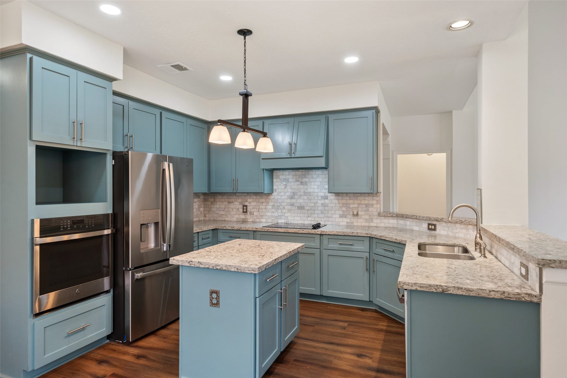 1123 Summer Brook, Sugar Land, TX 77479 At the heart of the home, this kitchen blends style and function with ease. Thoughtfully designed with modern finishes, generous counter space, and a layout that opens to the living area, its a space made for both everyday living and effortless entertainingwhere meals, conversations, and memories all come together.