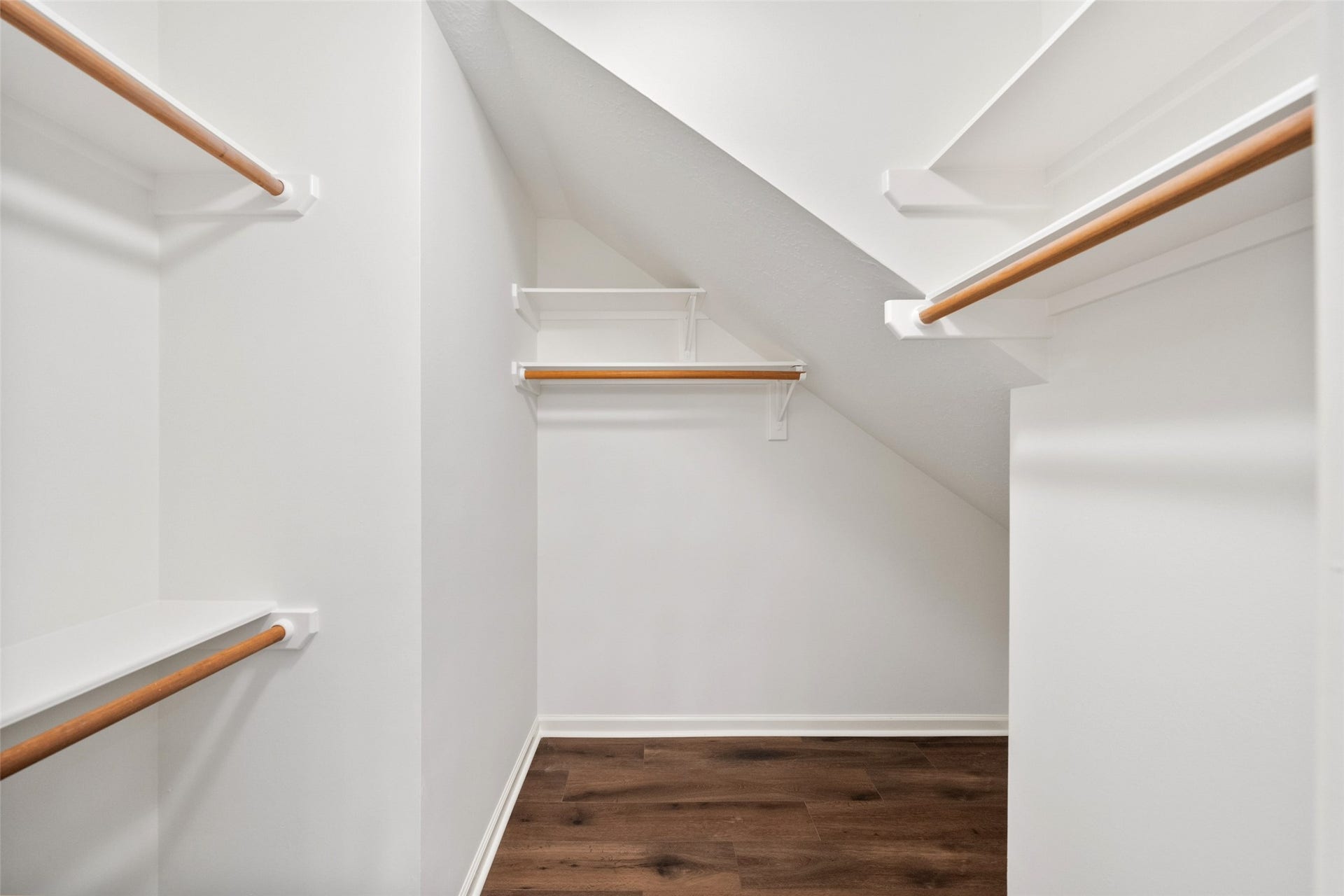 1123 Summer Brook, Sugar Land, TX 77479 One of two walk-in closets, this space offers generous storage with a clean, functional layout. Designed to keep everything organized and within reach, it adds everyday convenience to the primary suite experience.