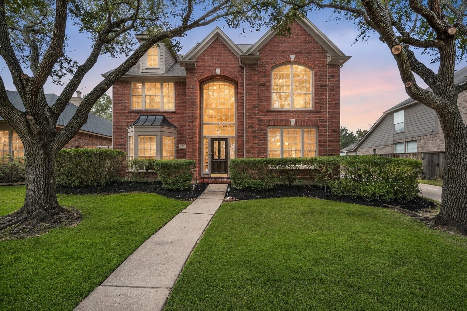 1123 Summer Brook, Sugar Land, TX 77479 A timeless brick faade welcomes you home with storybook charm, framed by mature trees and a manicured lawn that sets the tone before you ever step inside. The inviting front entry creates a warm first impression, offering a sense of arrival that feels both elegant and comfortingwhere everyday living begins to feel just a little more special.
