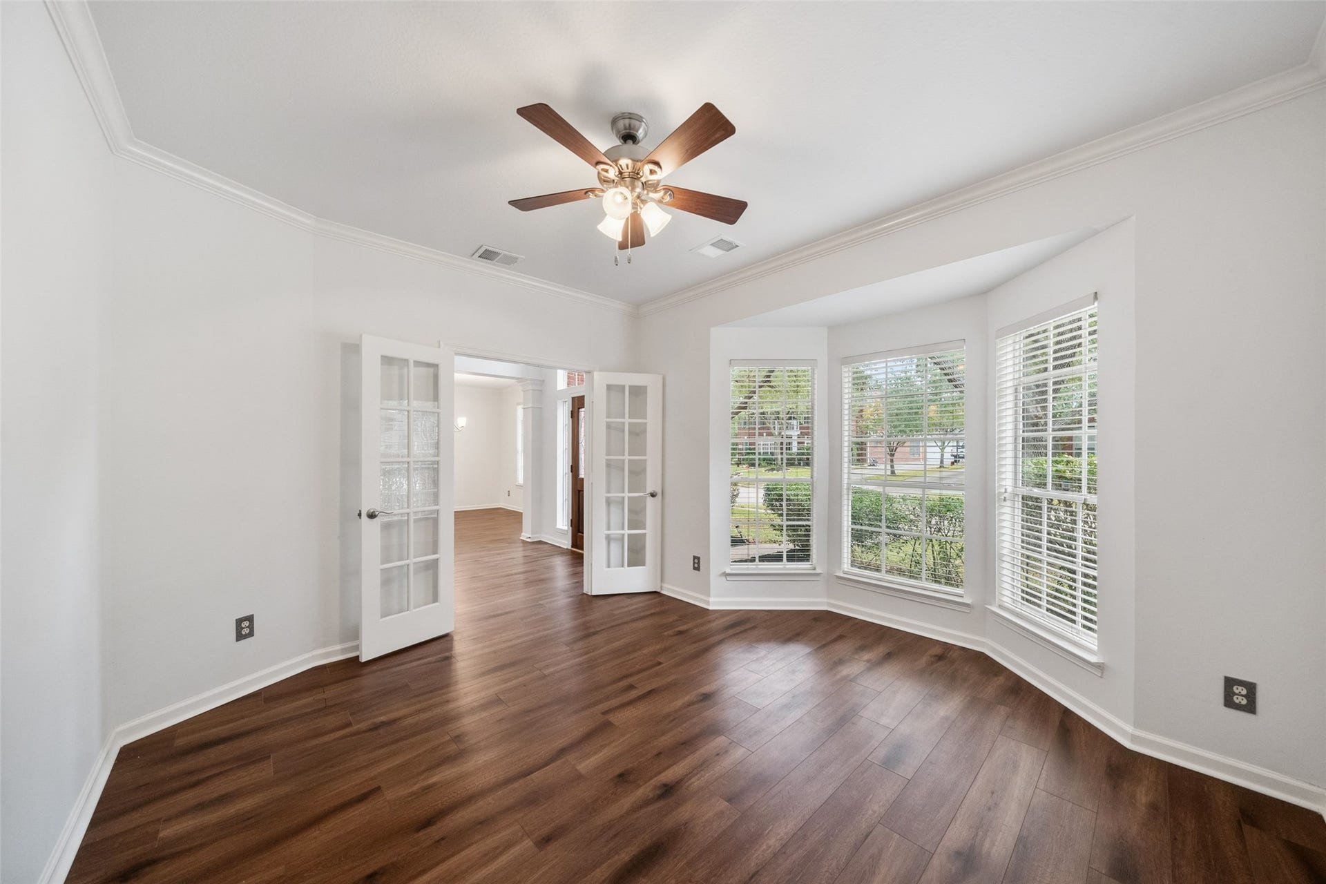 1123 Summer Brook, Sugar Land, TX 77479 With its expansive windows and refined architectural details, this study captures the essence of quiet luxury. The French doors provide both privacy and presence, creating a refined space that feels intentionalwhether used for work, reflection, or simply enjoying the view.