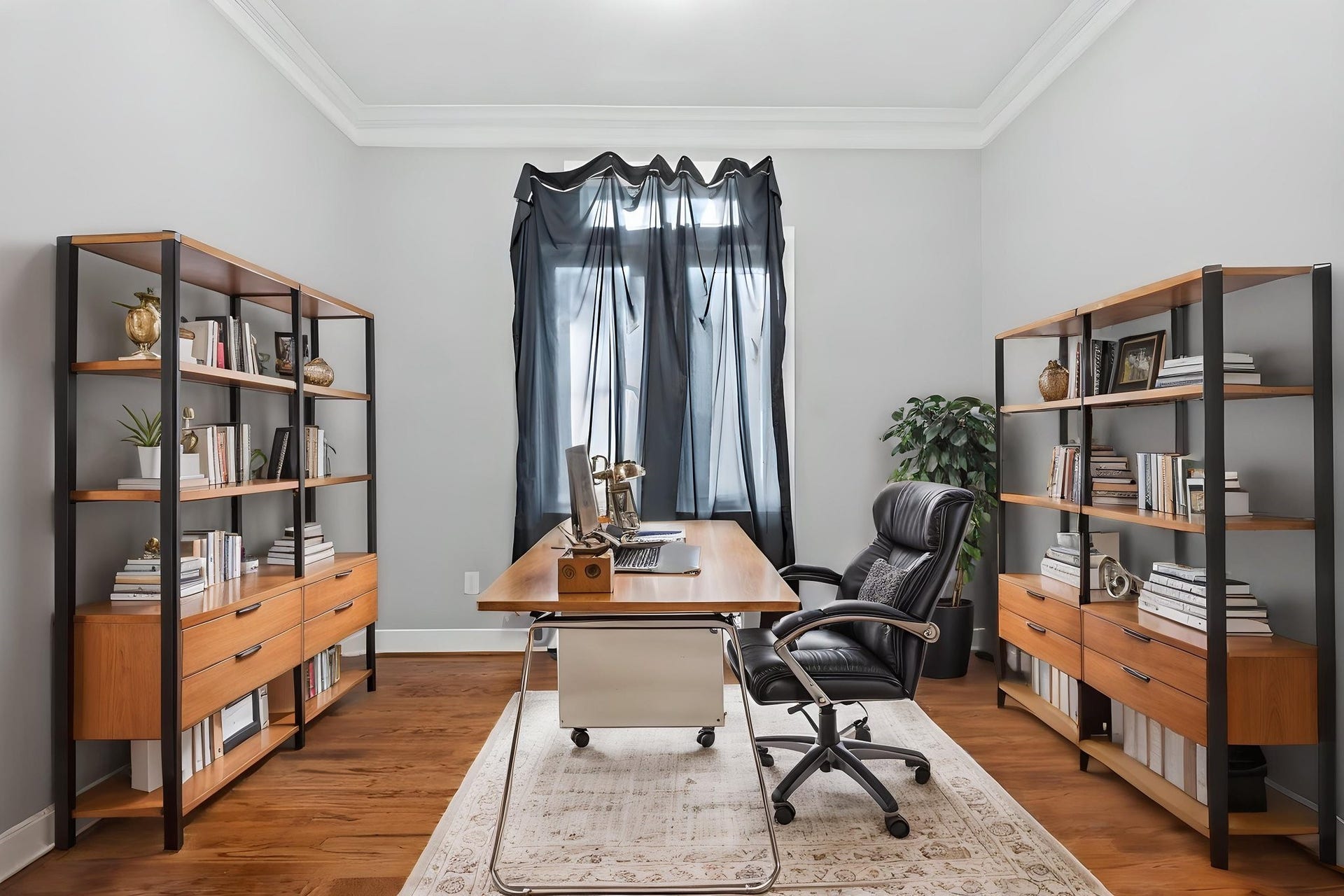 A home office with built in bookshelves.