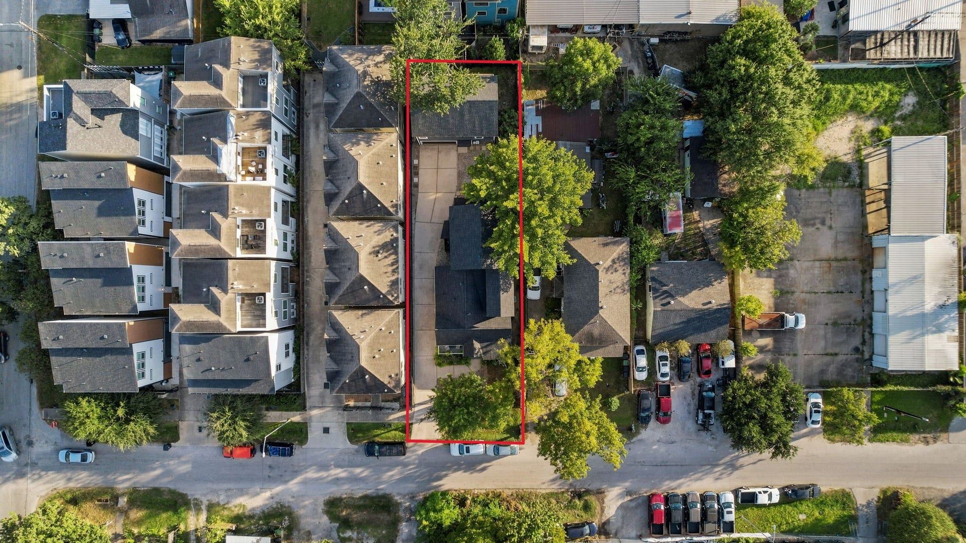 An aerial showing nearby development.