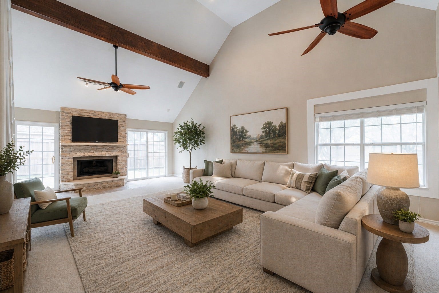 519 E Hillary Circle, Sugar Land, TX 77498 The expansive family room featuring a striking stone surround gas-log fireplace. - Virtually Staged