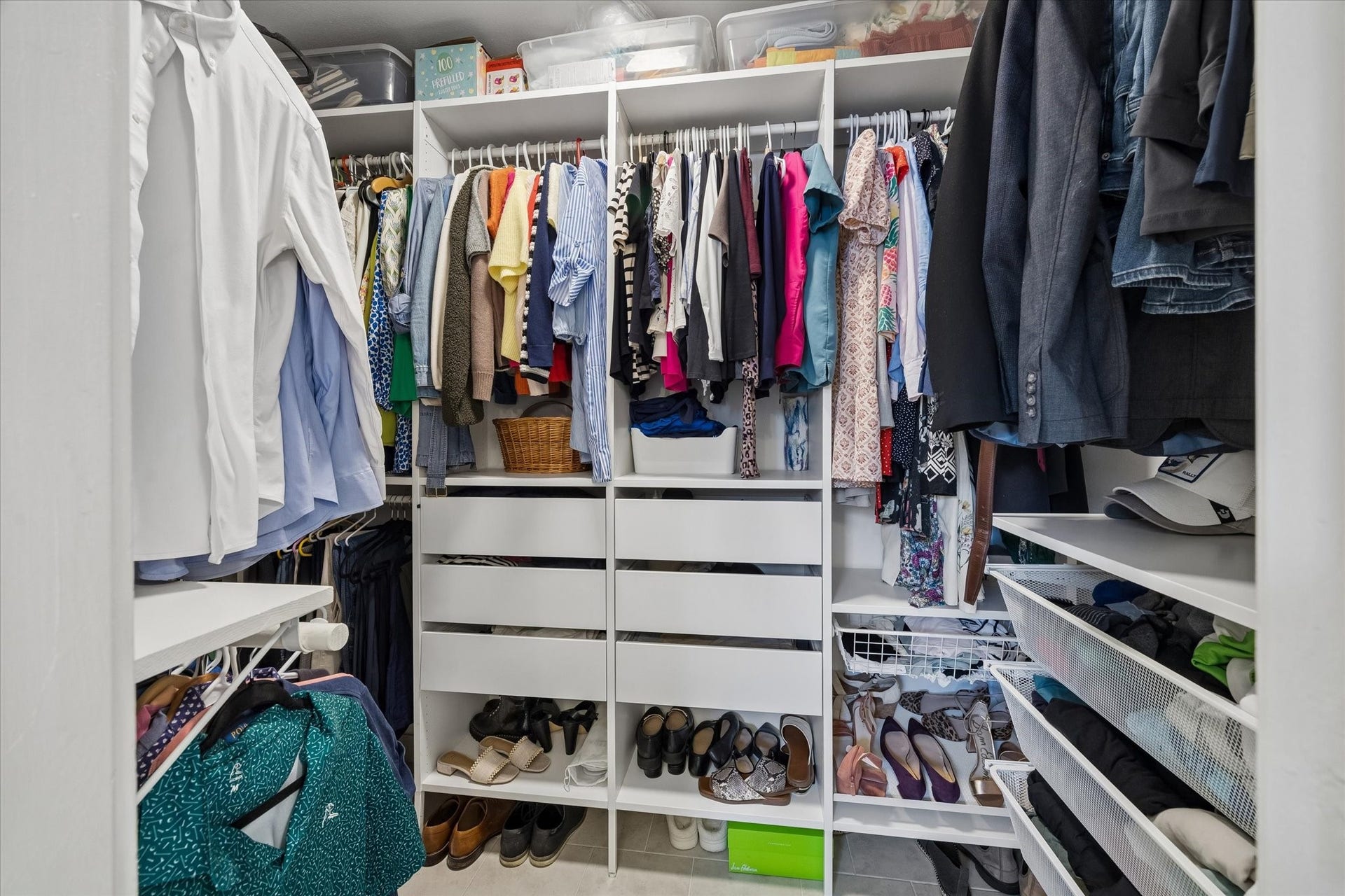 1232 Chantilly Lane, Houston, TX 77018 Generous walk in primary closet features a custom organization system with built in drawers, shelving, shoe storage, and ample hanging space.