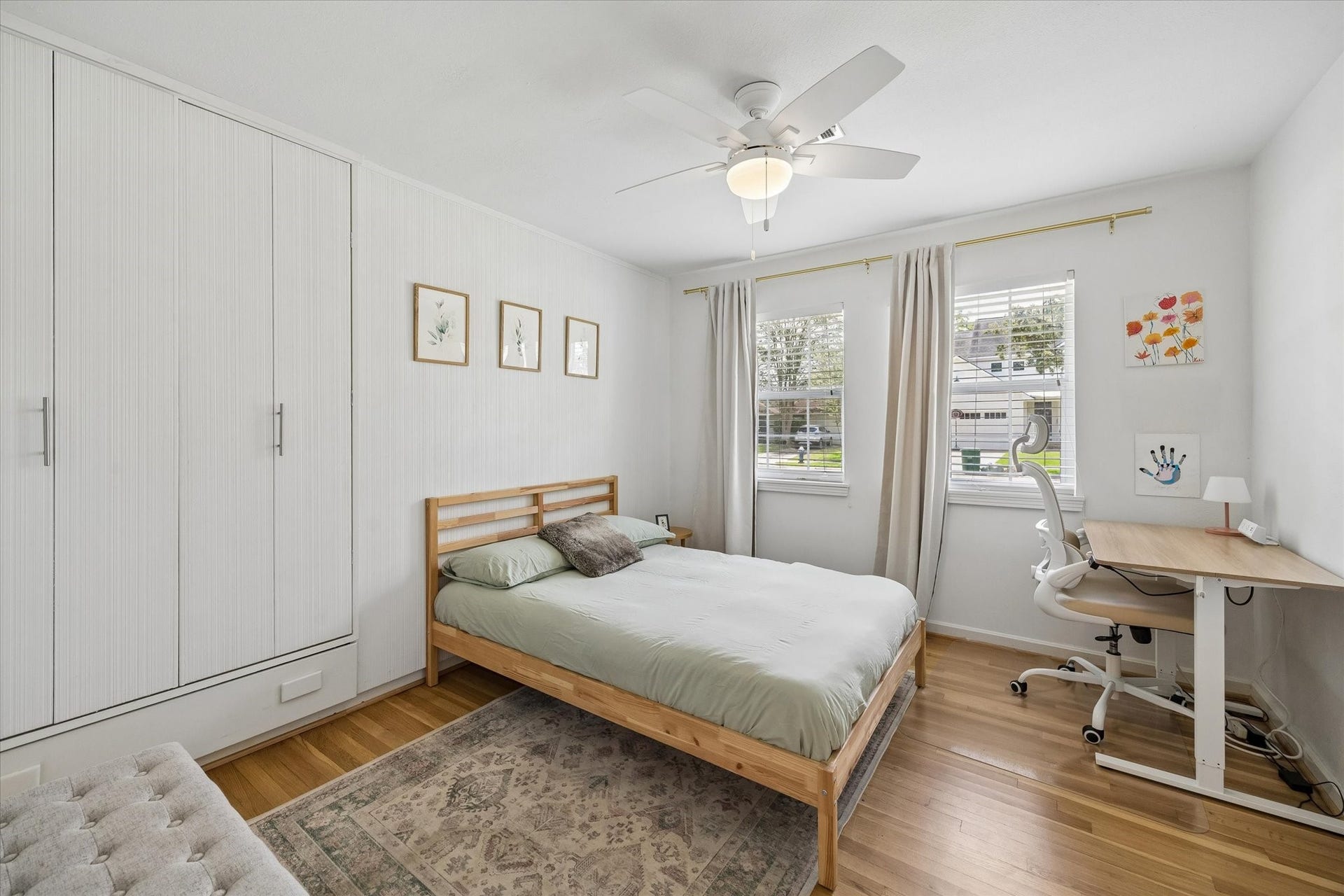 1232 Chantilly Lane, Houston, TX 77018 Secondary bedroom offers hardwood floors, abundant natural light, built in storage, and plenty of space for a home office setup.