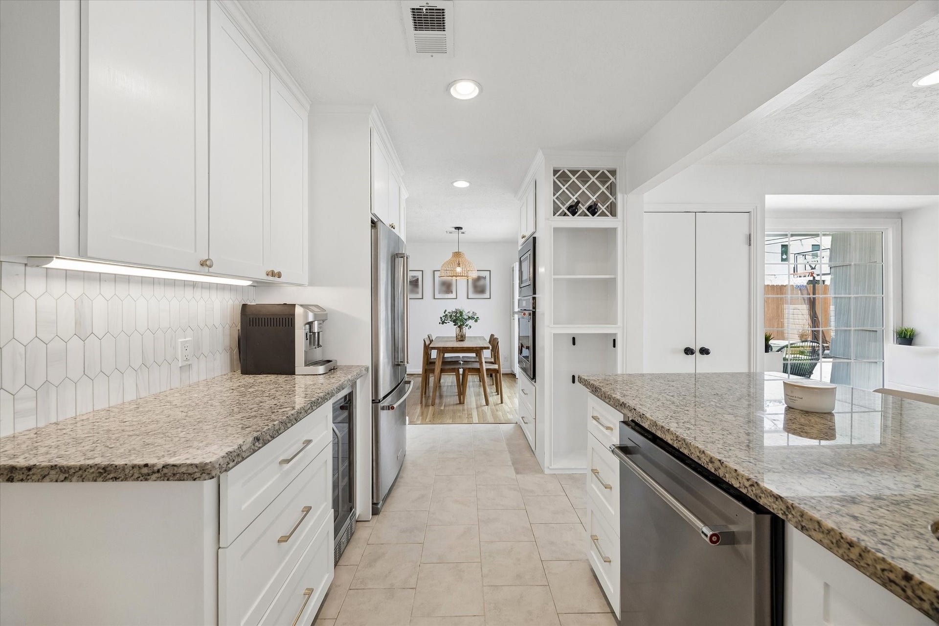 1232 Chantilly Lane, Houston, TX 77018 Well designed kitchen offers abundant storage, built in wine storage, stainless steel appliances, and a convenient flow into the dining and living spaces.