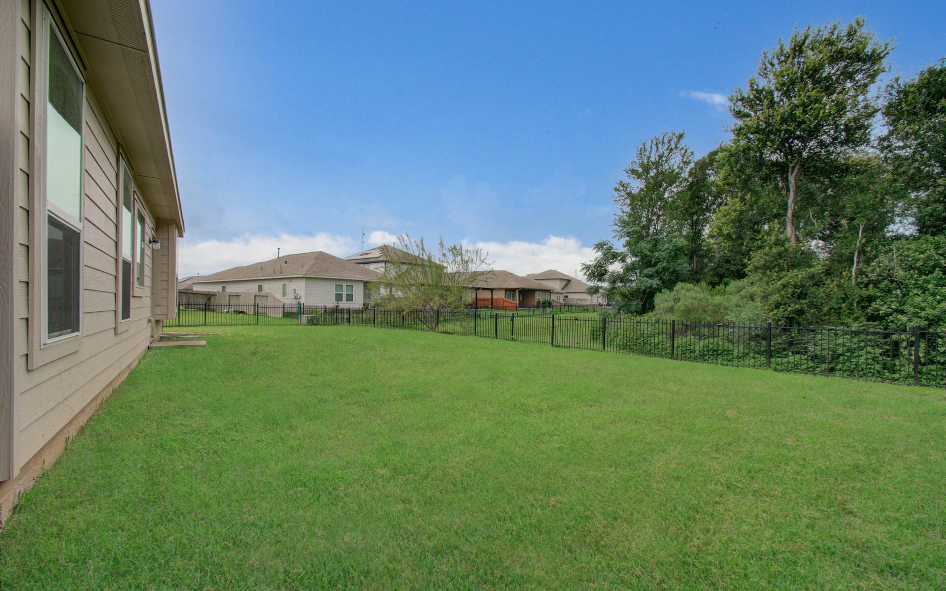3403 Brazos Falls Dr, Richmond, TX 77469 Side yard view showing the generous lot size and room to grow.
