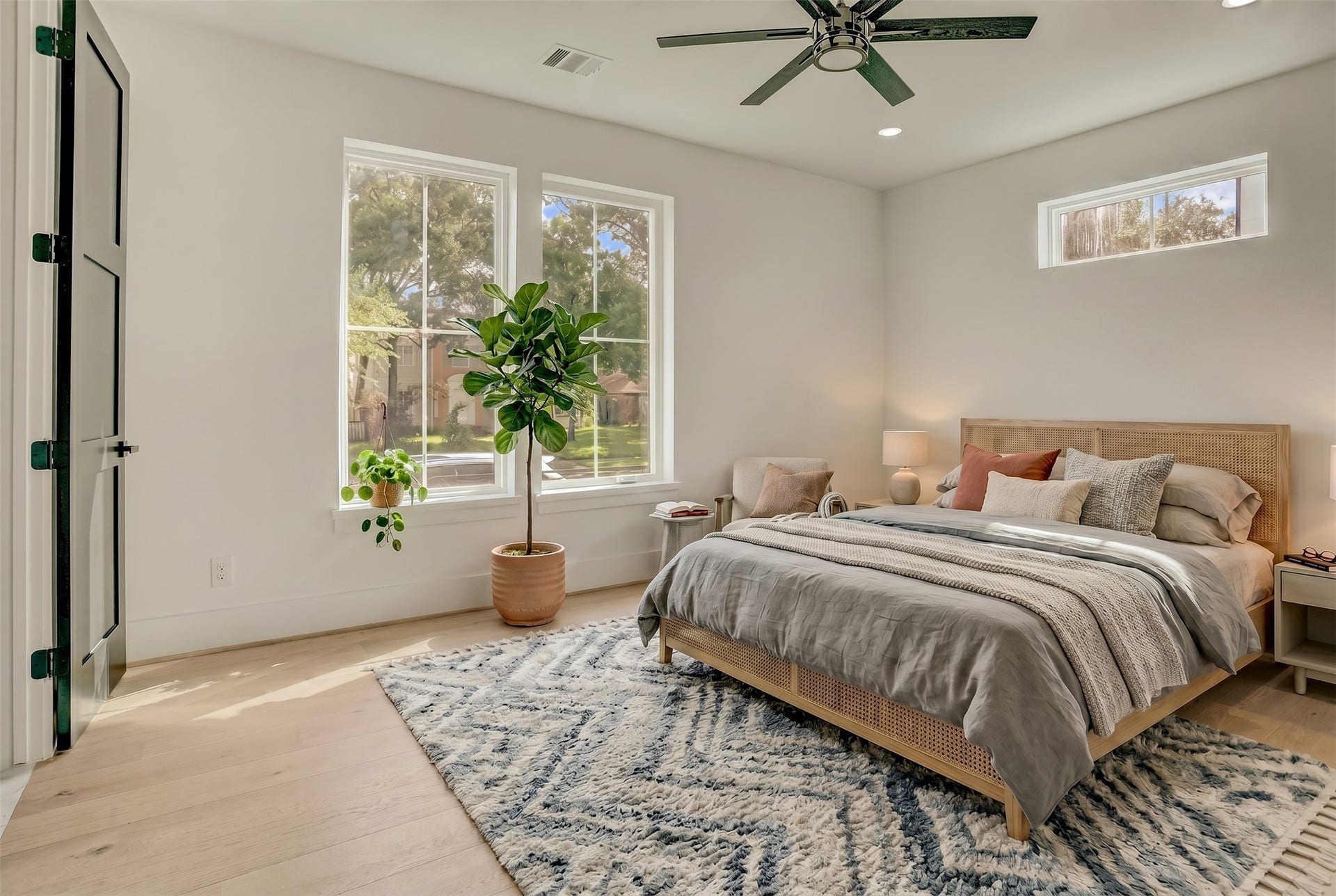 1907 Lauderdale Street, Houston, TX 77030 The first floor bedroom suite offers a sizable room and views of the yard space. Virtually staged photo.