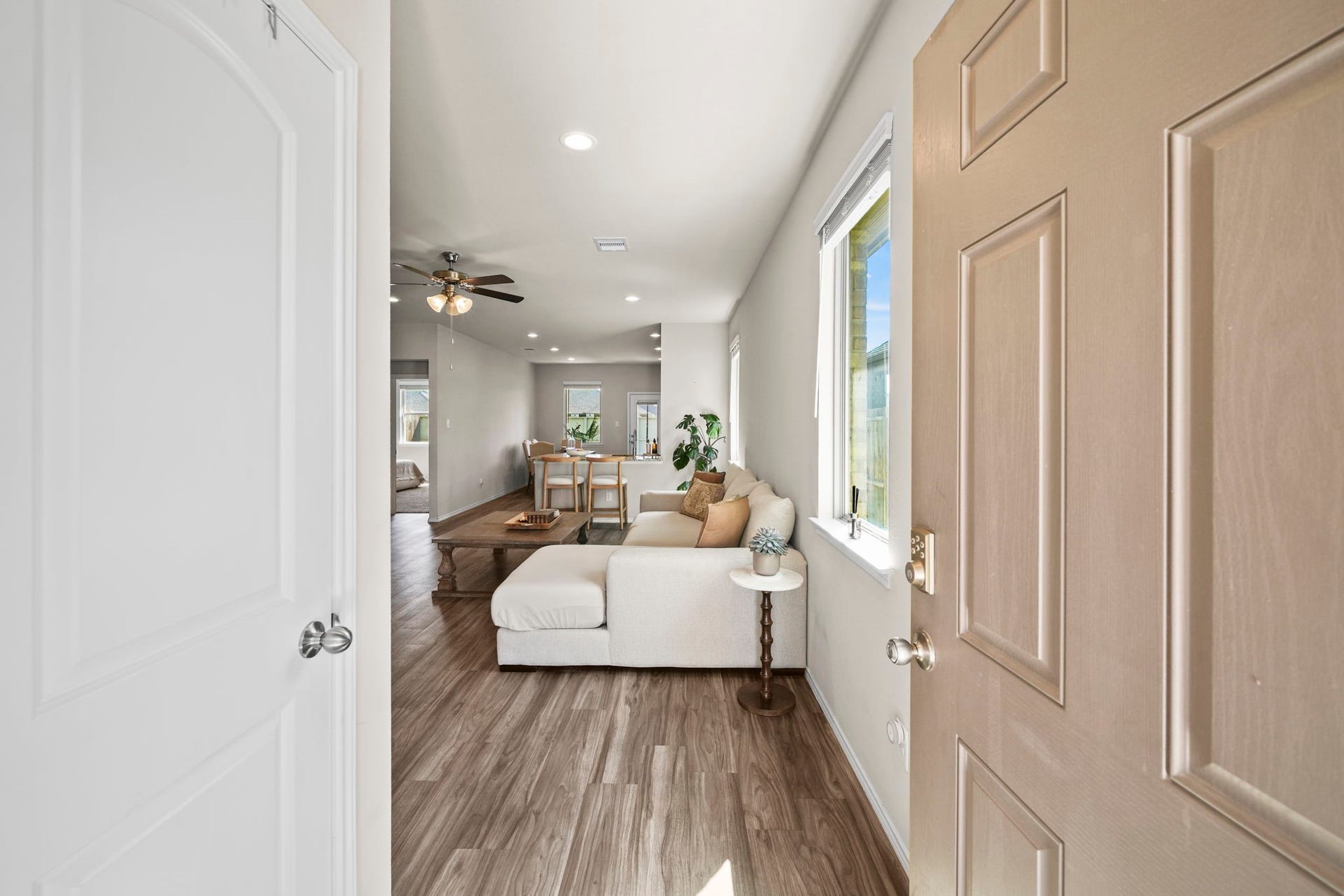 Welcoming entryway that opens into a bright, inviting living space with a seamless flow throughout the home.
