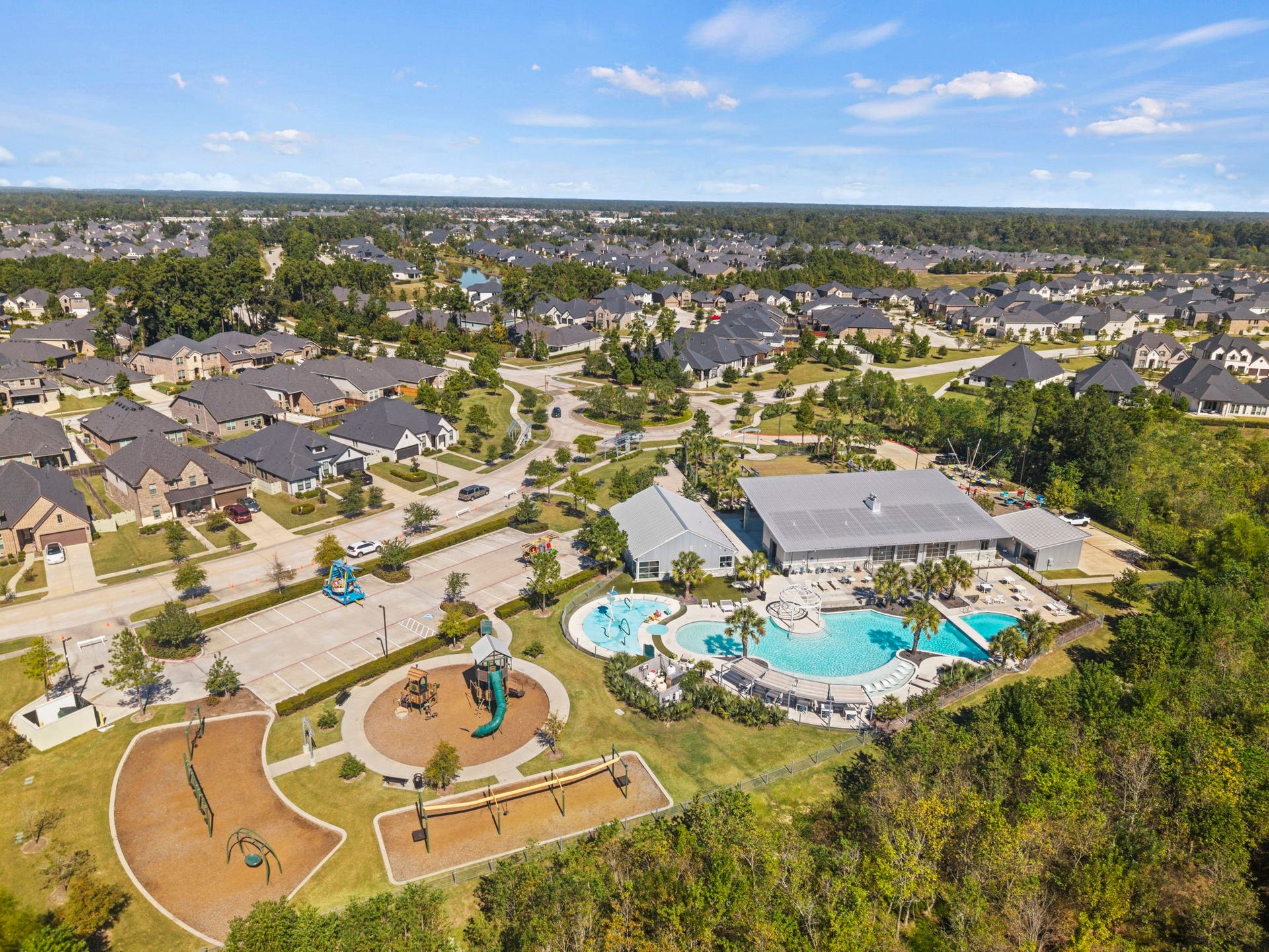 Enjoy resort-style community amenities featuring a clubhouse, sparkling pool, splash pad, playground, and scenic walking trails.