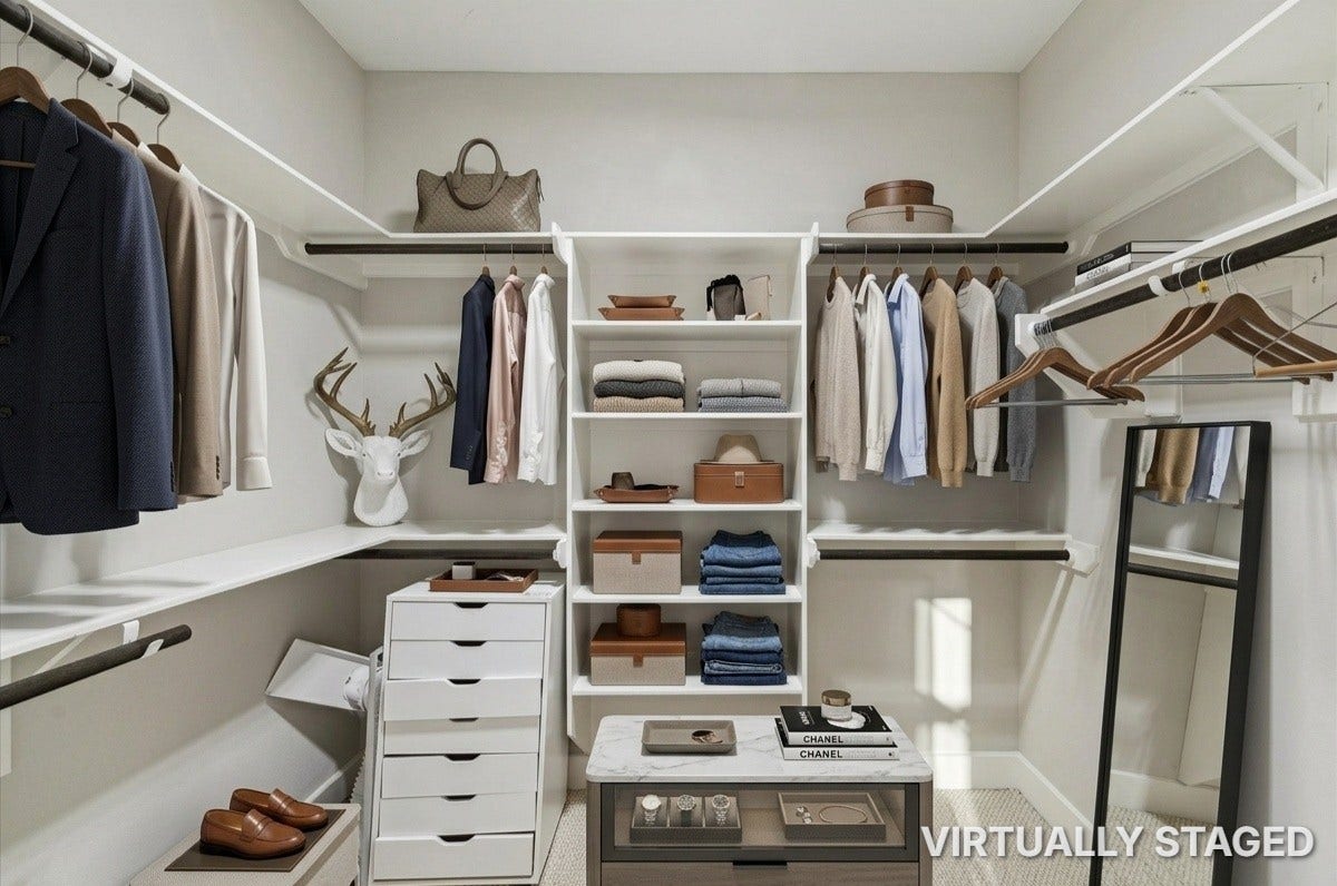 2805 Blodgett Street, #C, Houston, TX 77004 Spacious walk-in closet with ample hanging space, organized shelving, and a stylish neutral palette, ideal for maximizing storage and style.