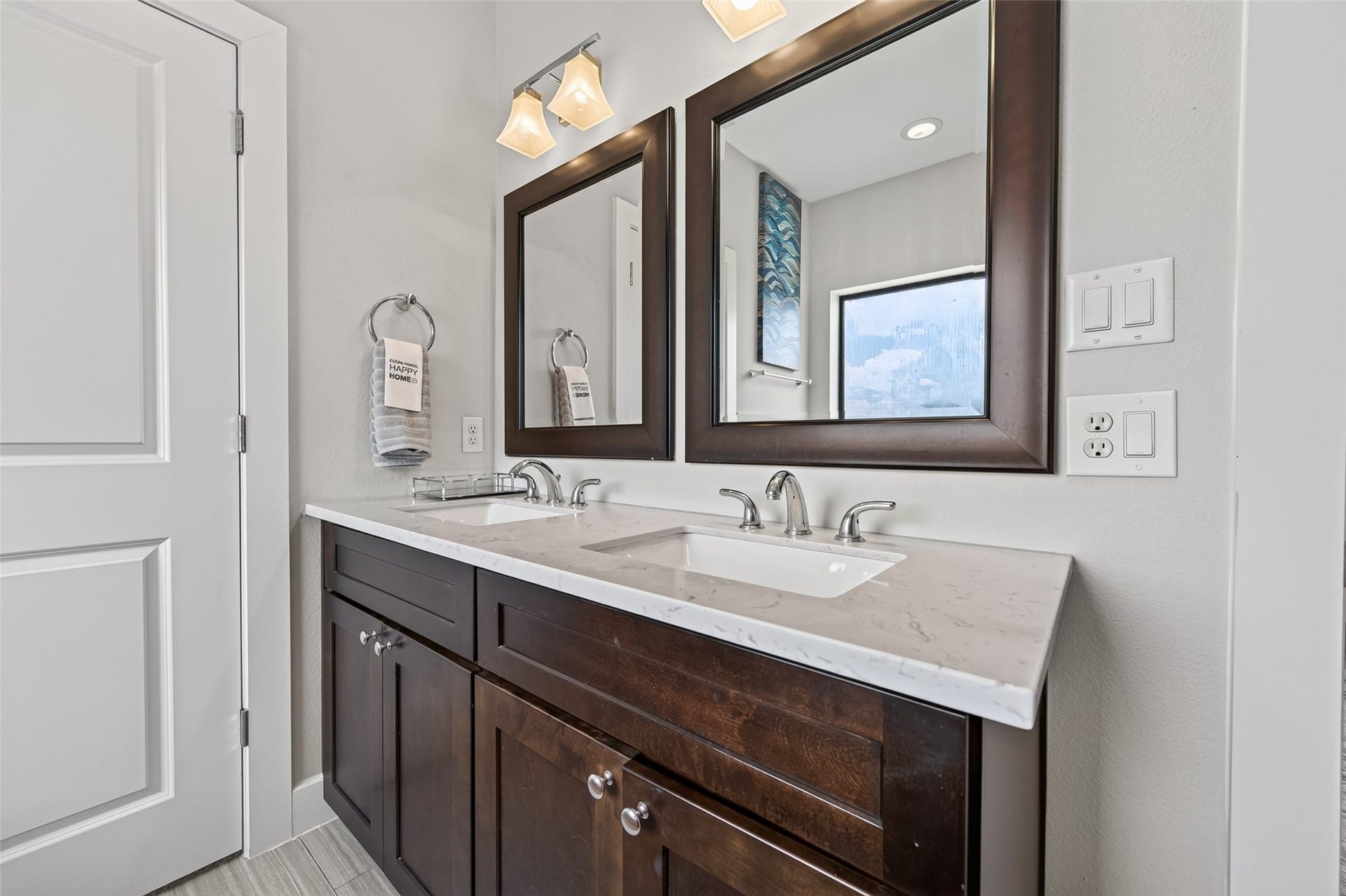 2805 Blodgett Street, #C, Houston, TX 77004 Elegant bathroom featuring a spacious bathtub, double vanity with sleek countertops, and modern fixtures, all accented by stylish tile flooring and ample natural light.