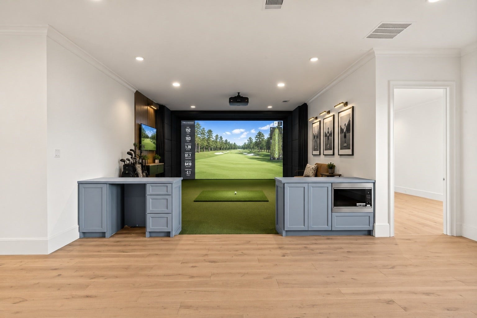 1610 Hillendahl Boulevard, Houston, TX 77055 *Golf simulator lounge concept, virtually staged to illustrate a potential use of the space. Ceiling height accommodates the possibility of a golf simulator installation. Image is for inspirational purposes only.*