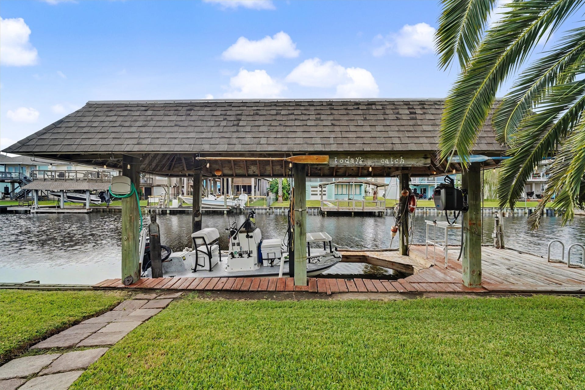 Skip the monthly expense of off-site boat storage and keep your boat right at home and ready for your next adventure! With a private boathouse and boat lift, you're just steps away from launching into the water