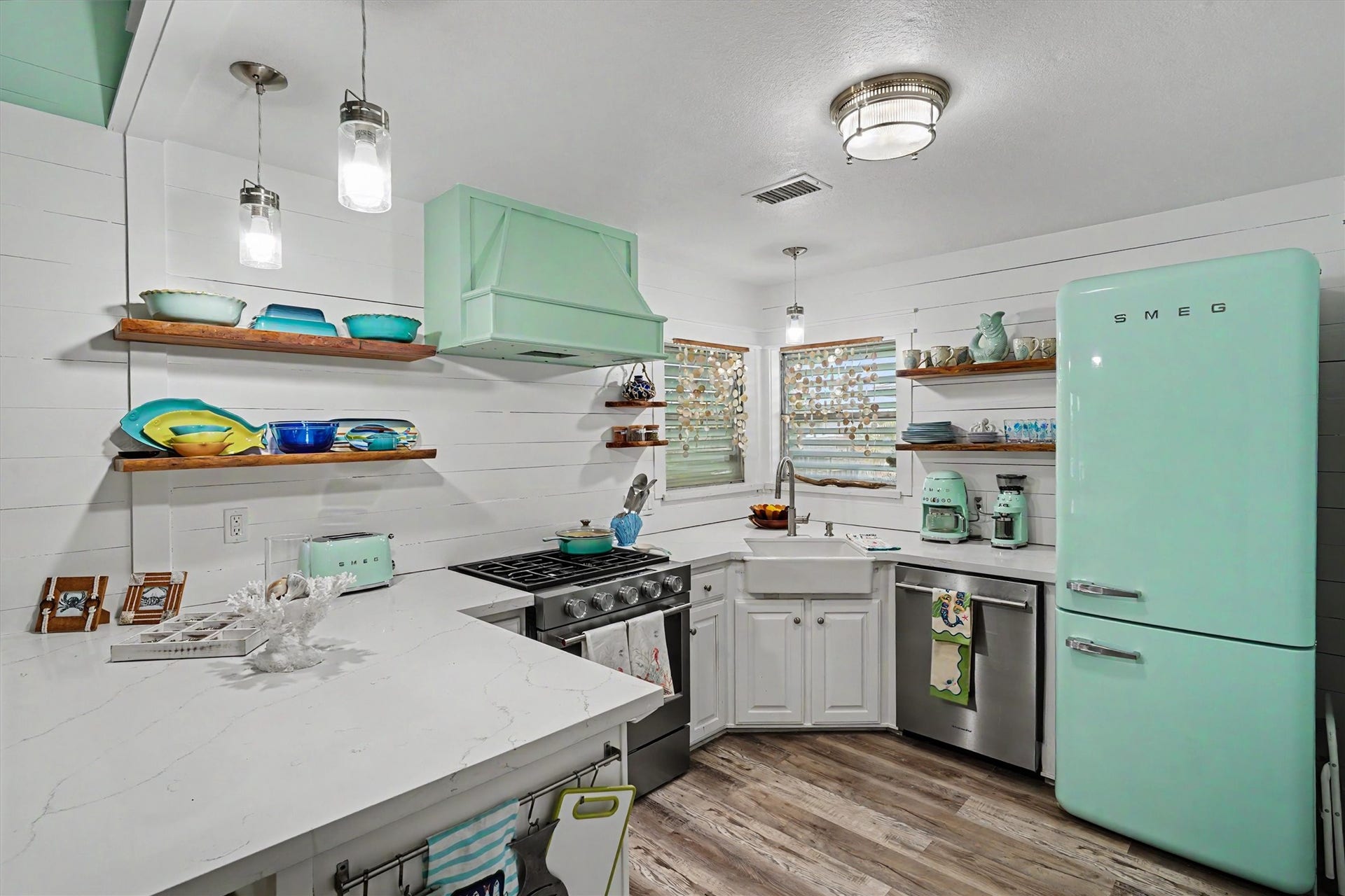 From the quartz countertops to the high-end appliances, every detail of this kitchen was thoughtfully updated to create a space that's as beautiful as it is functional