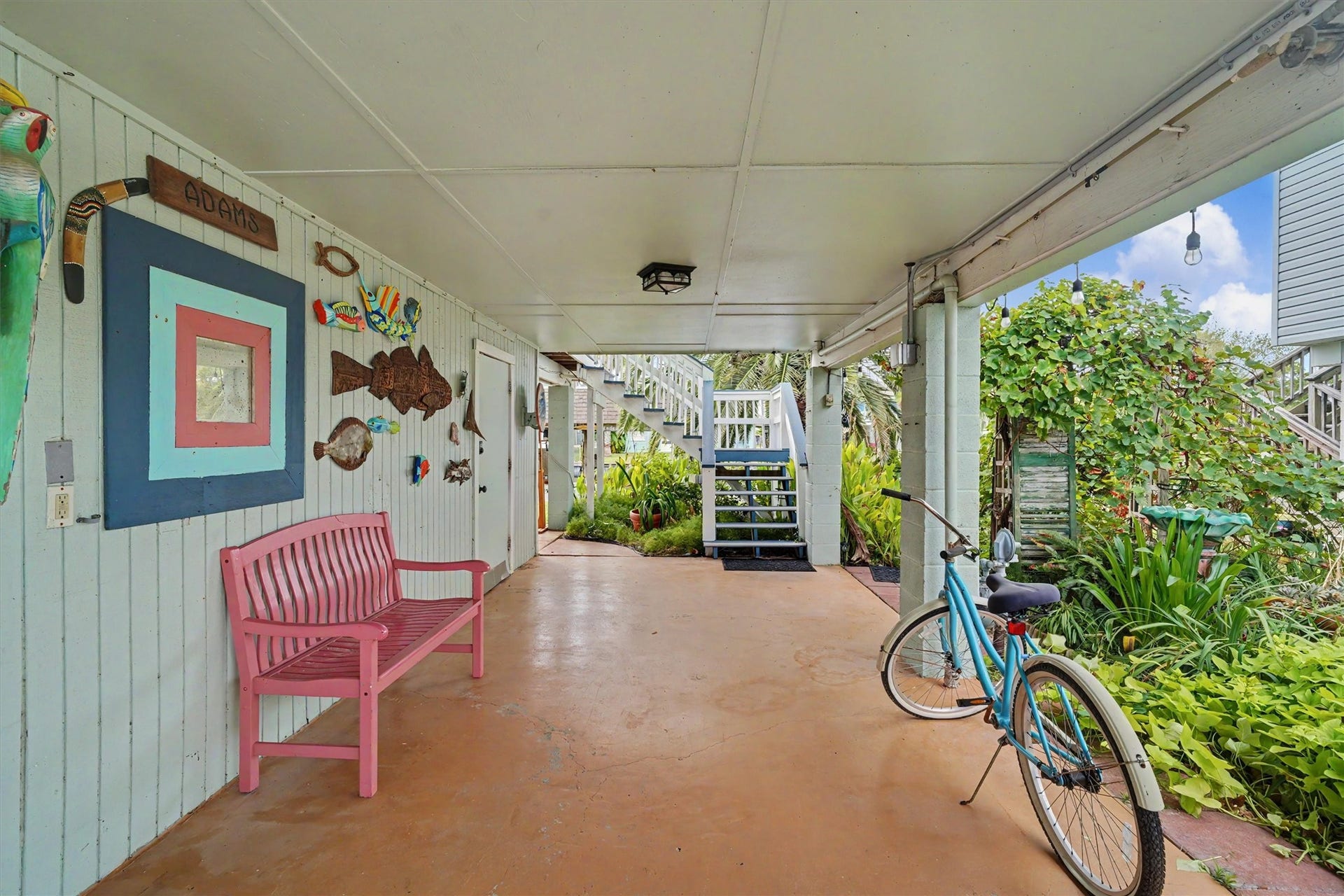 An expansive downstairs open-bay area with room to relax, gather, entertain, and enjoy the waterfront lifestyle