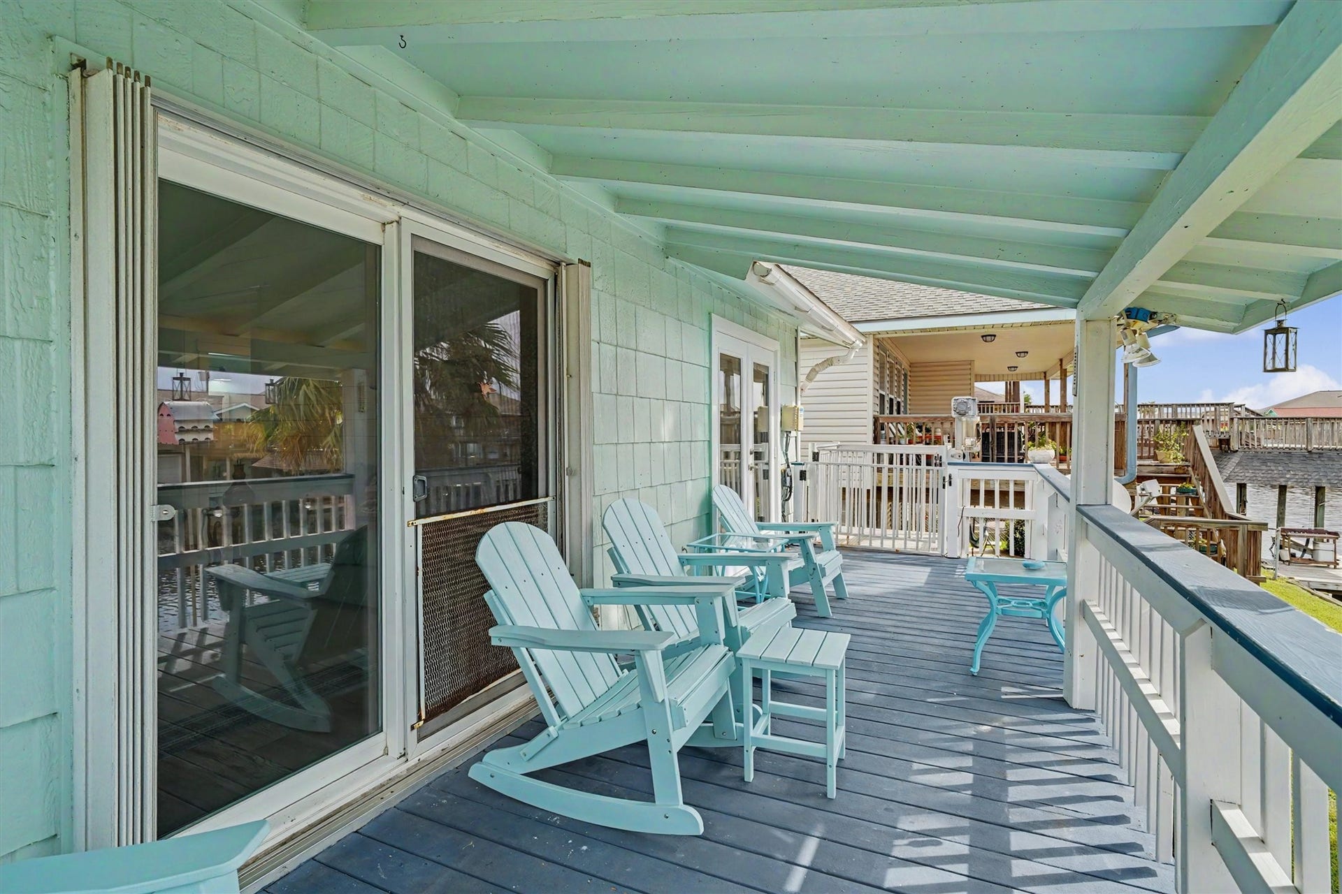 Enjoy the covered upstairs porch with recently installed French doors, creating an inviting connection between indoor and outdoor living. Another set of French doors opens directly into the primary bedroom, bringing the waterfront lifestyle right to your doorstep. Plus, the cargo lift makes transporting groceries, coolers, and everything else from downstairs a breeze!