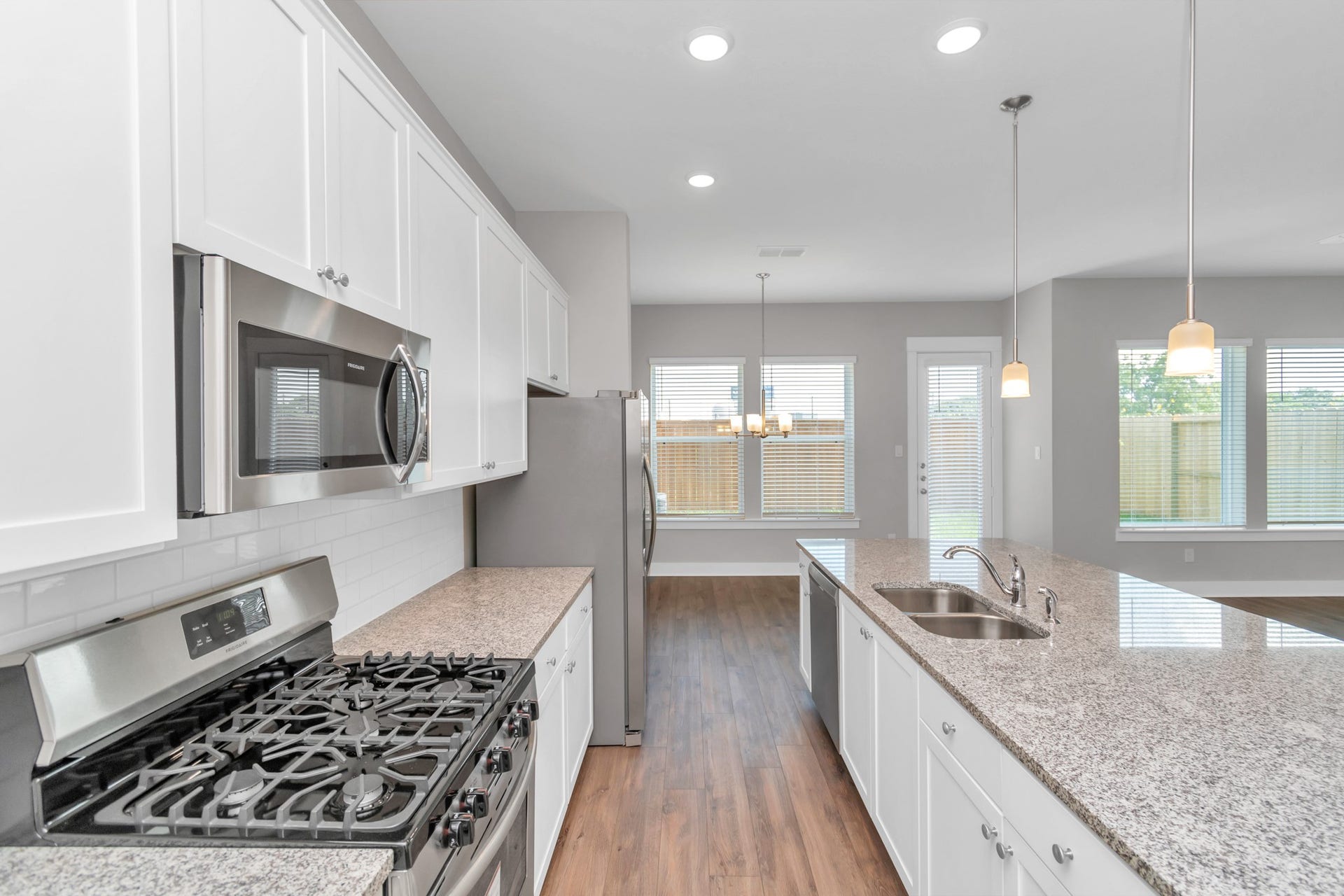 Elegant Granite Countertops & Stainless Steel Appliances.