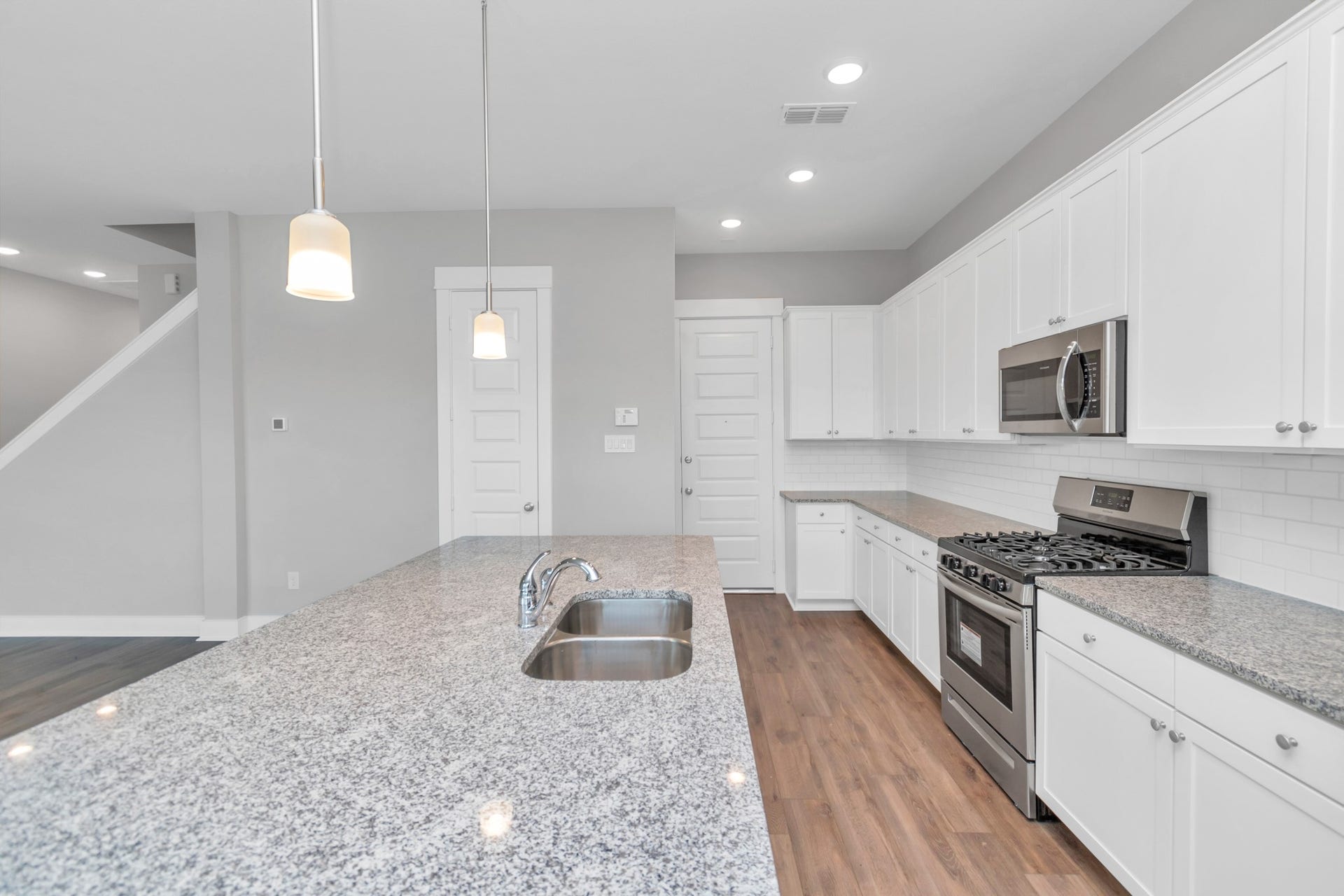 Elegant Granite Countertops & Stainless Steel Appliances.