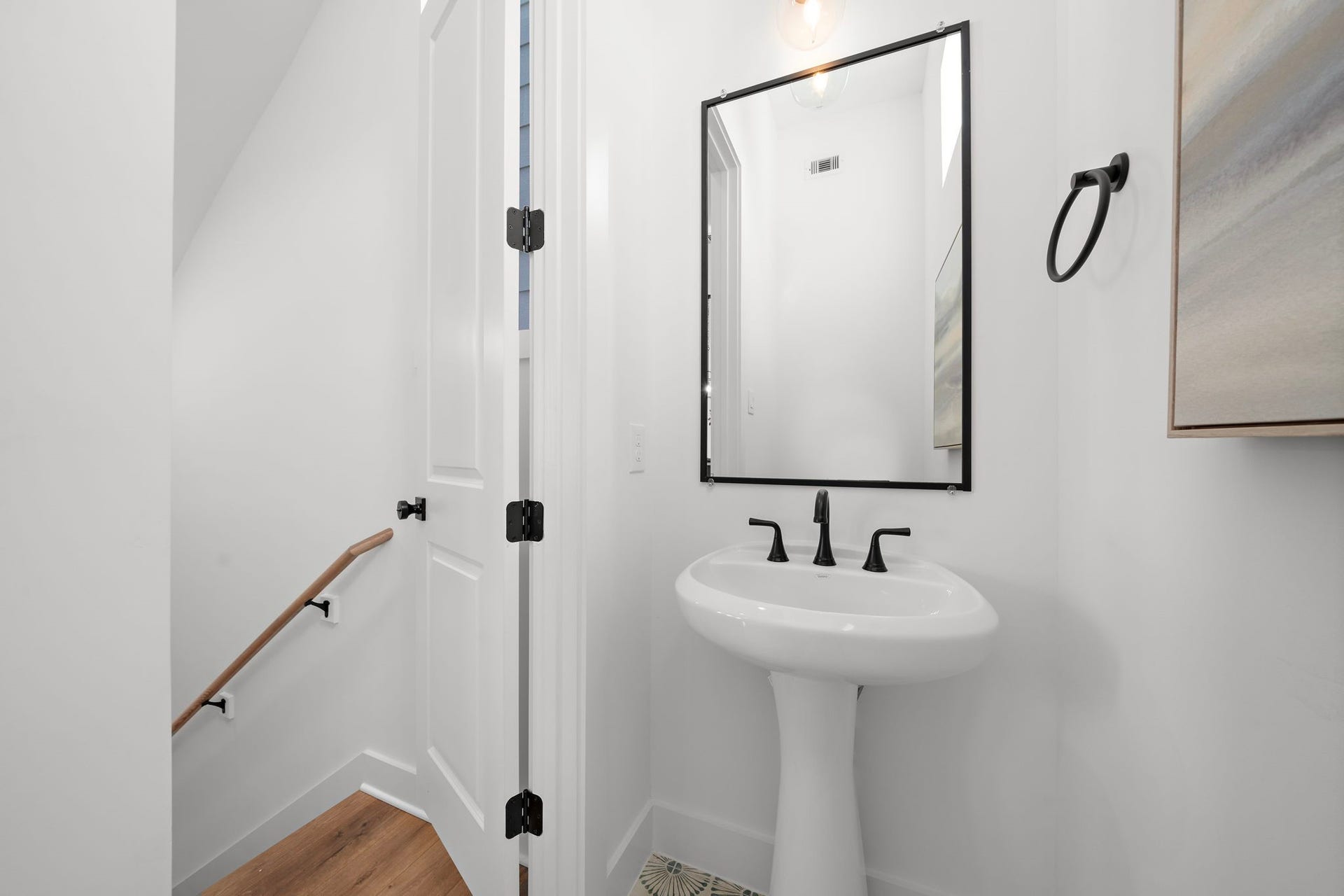 835 Elkhart Street, #E, Houston, TX 77091 Compact and stylish half bath with modern fixtures, perfect for guests.