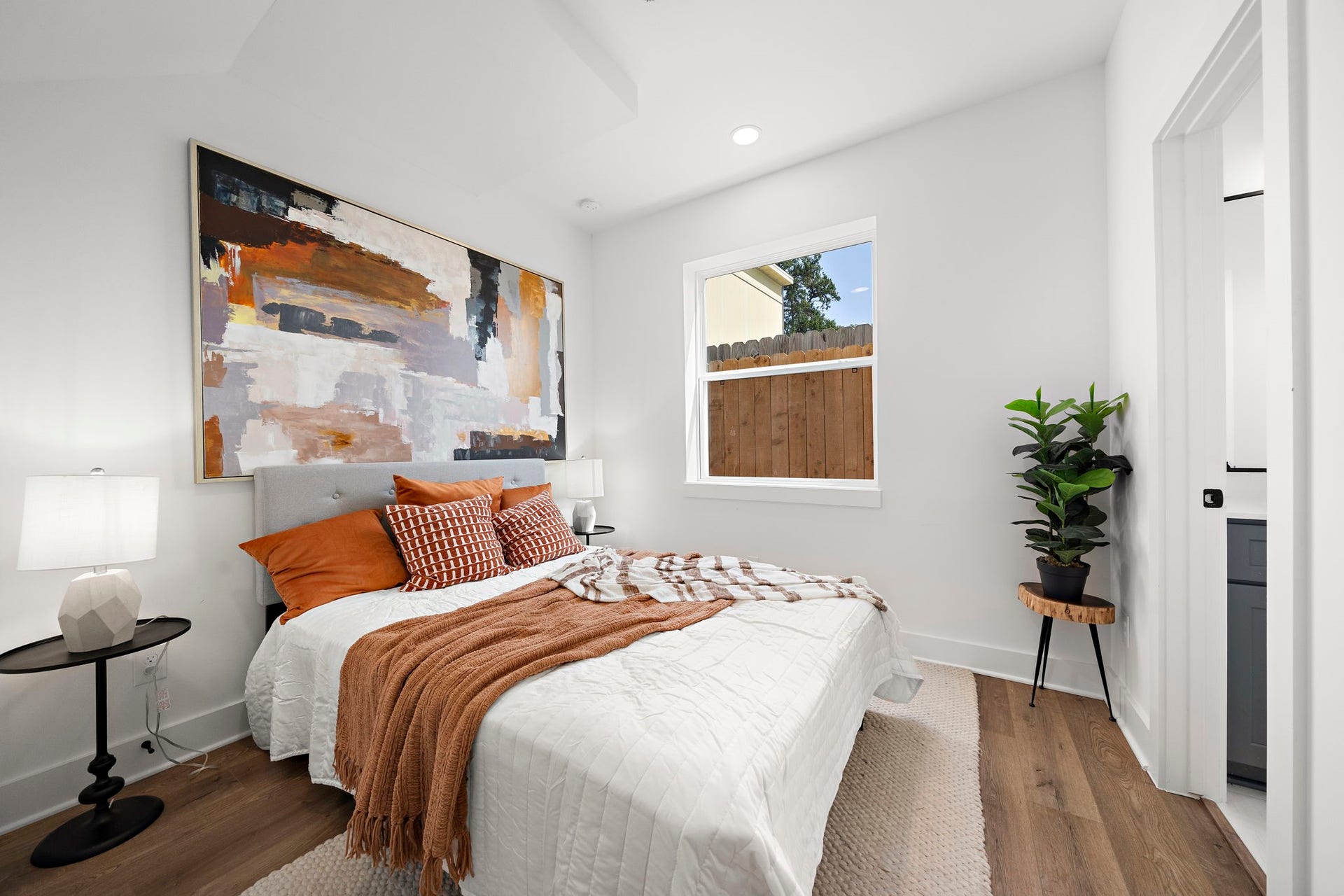 835 Elkhart Street, #E, Houston, TX 77091 Versatile first-floor bedroom with private full bathroom, perfect as an office or guest suite.