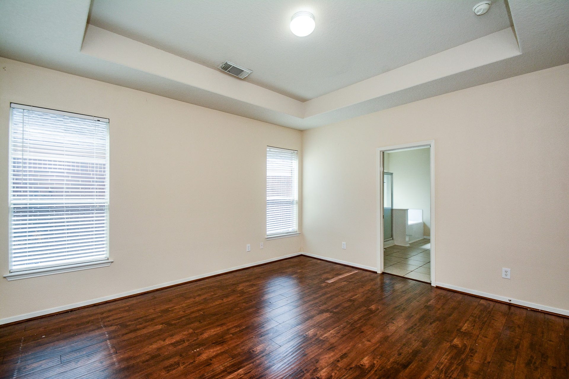 18507 Lodgepole Pine Street, Cypress, TX 77429 Another view of the primary bedroom with en suite bathroom. Inset ceiling and beautiful flooring