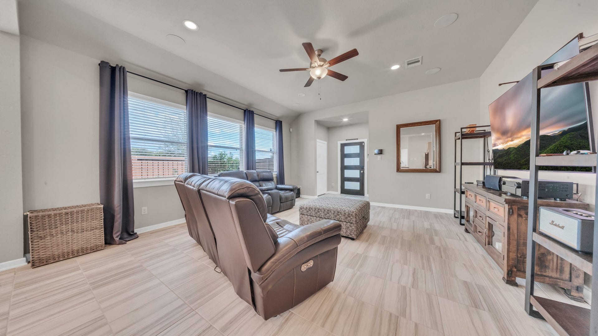 6123 Dovetail Cliff Court, Katy, TX 77493 Oversized windows and an open layout provide a warm and inviting atmosphere.