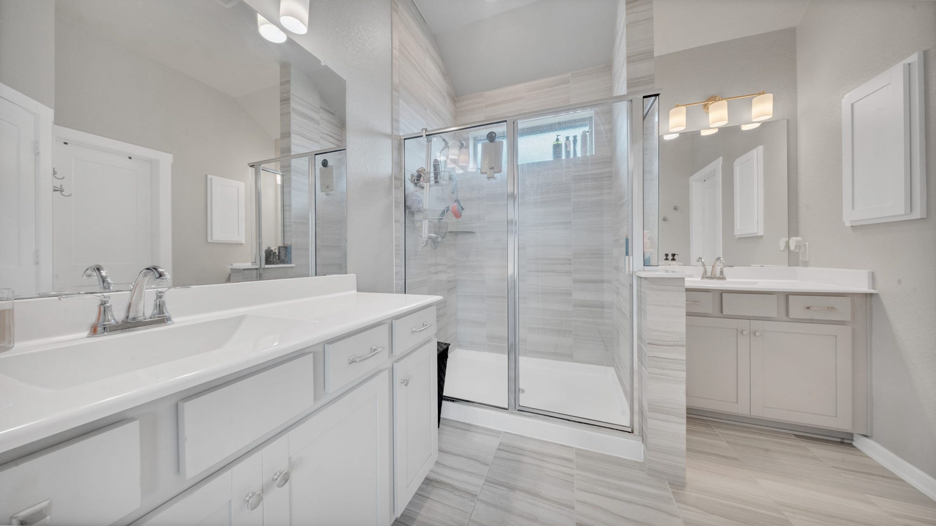 6123 Dovetail Cliff Court, Katy, TX 77493 Dual sink vanity with ample storage and contemporary fixtures.