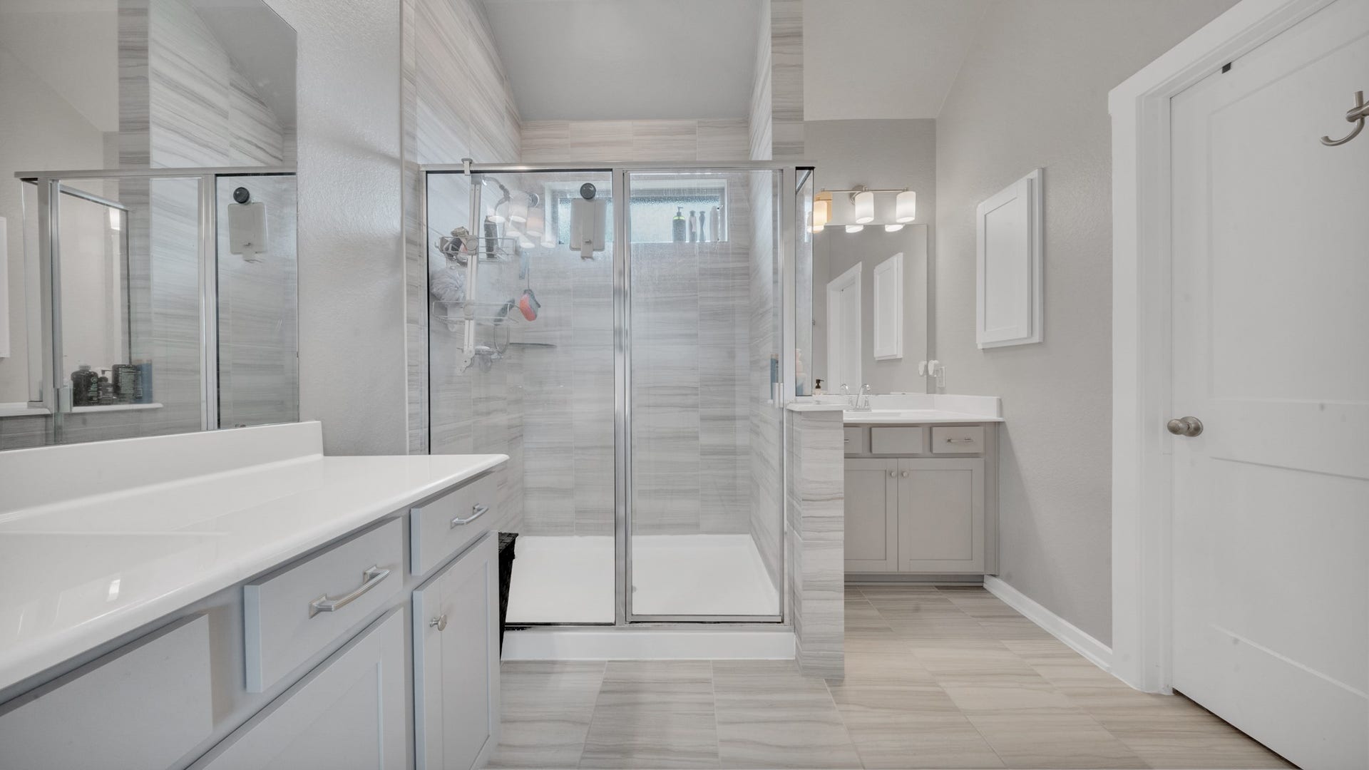6123 Dovetail Cliff Court, Katy, TX 77493 Beautifully designed bathroom offering two separate vanities and a bright, open layout.