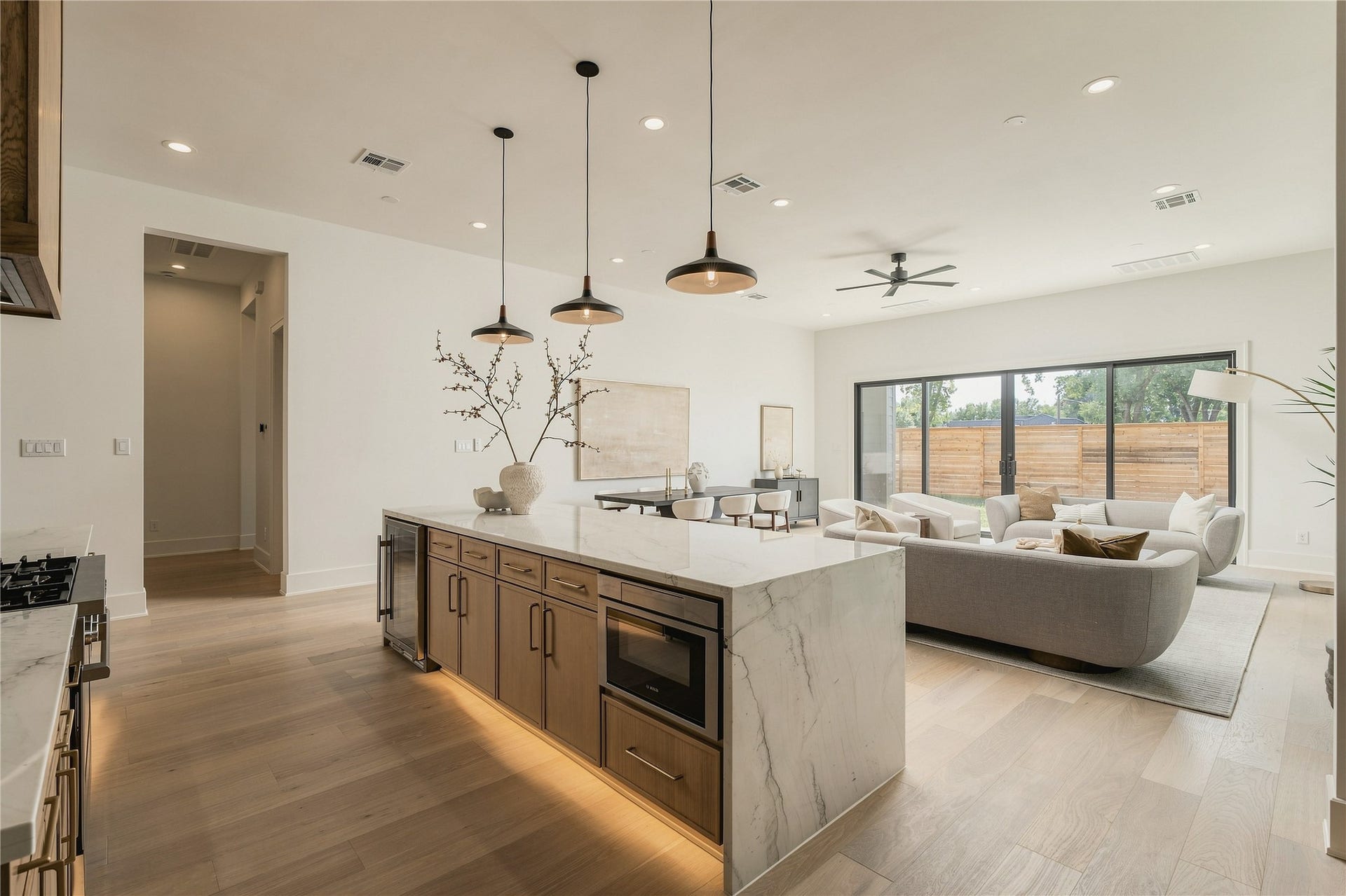 2109 McKean Drive, Houston, TX 77080 Designed for connection, the kitchen opens effortlessly into the main living area, with the expansive island creating a natural gathering place at the heart of the home.