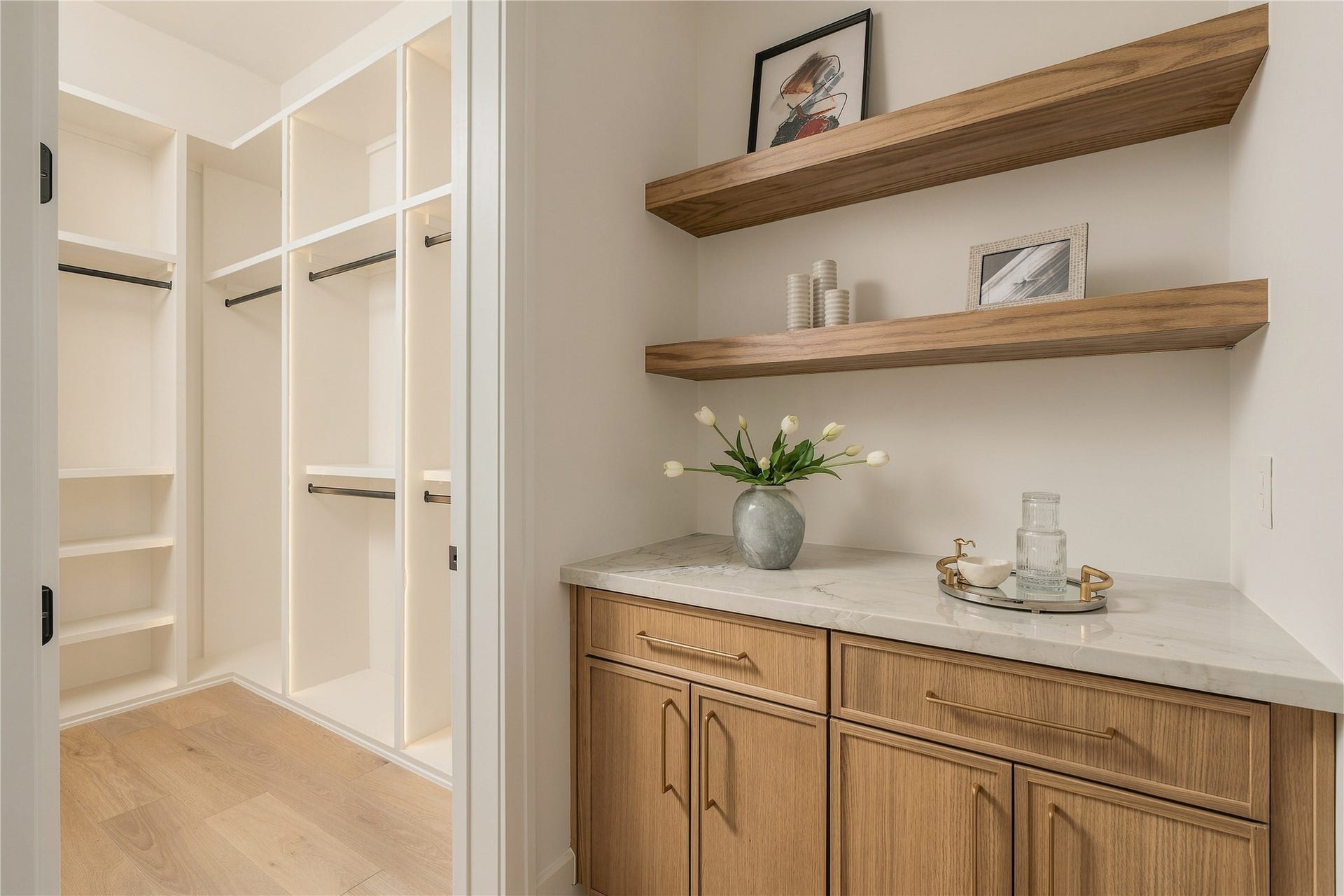 2109 McKean Drive, Houston, TX 77080 One of two closets in the primary bedroom with dedicated coffee bar within the primary suite adds a hotel-inspired touch, complete with custom cabinetry and open shelving for a refined morning ritual.
