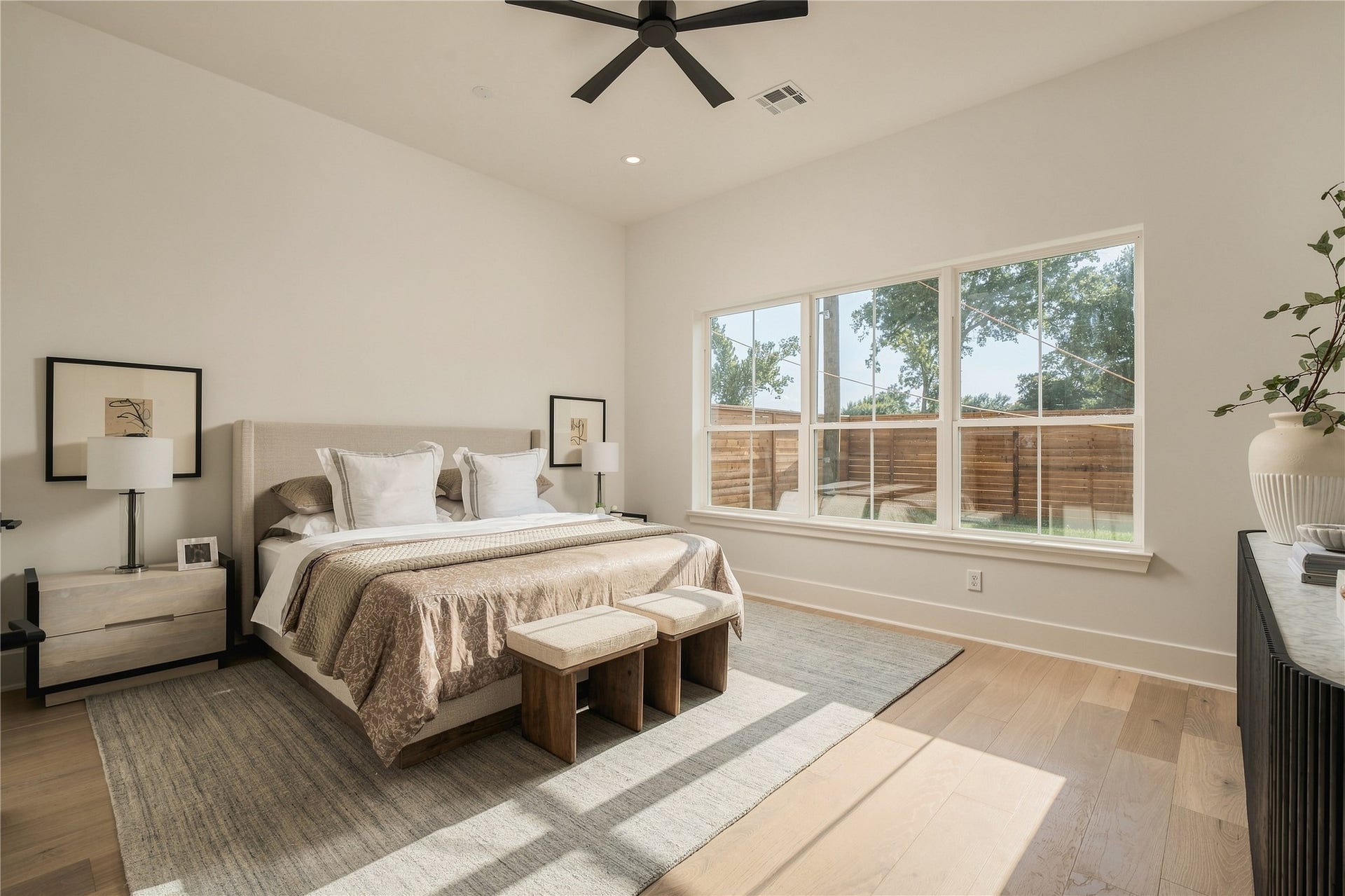 2109 McKean Drive, Houston, TX 77080 The primary suite offers impressive scale and abundant natural light, creating a serene retreat with ample room for a dedicated sitting area.