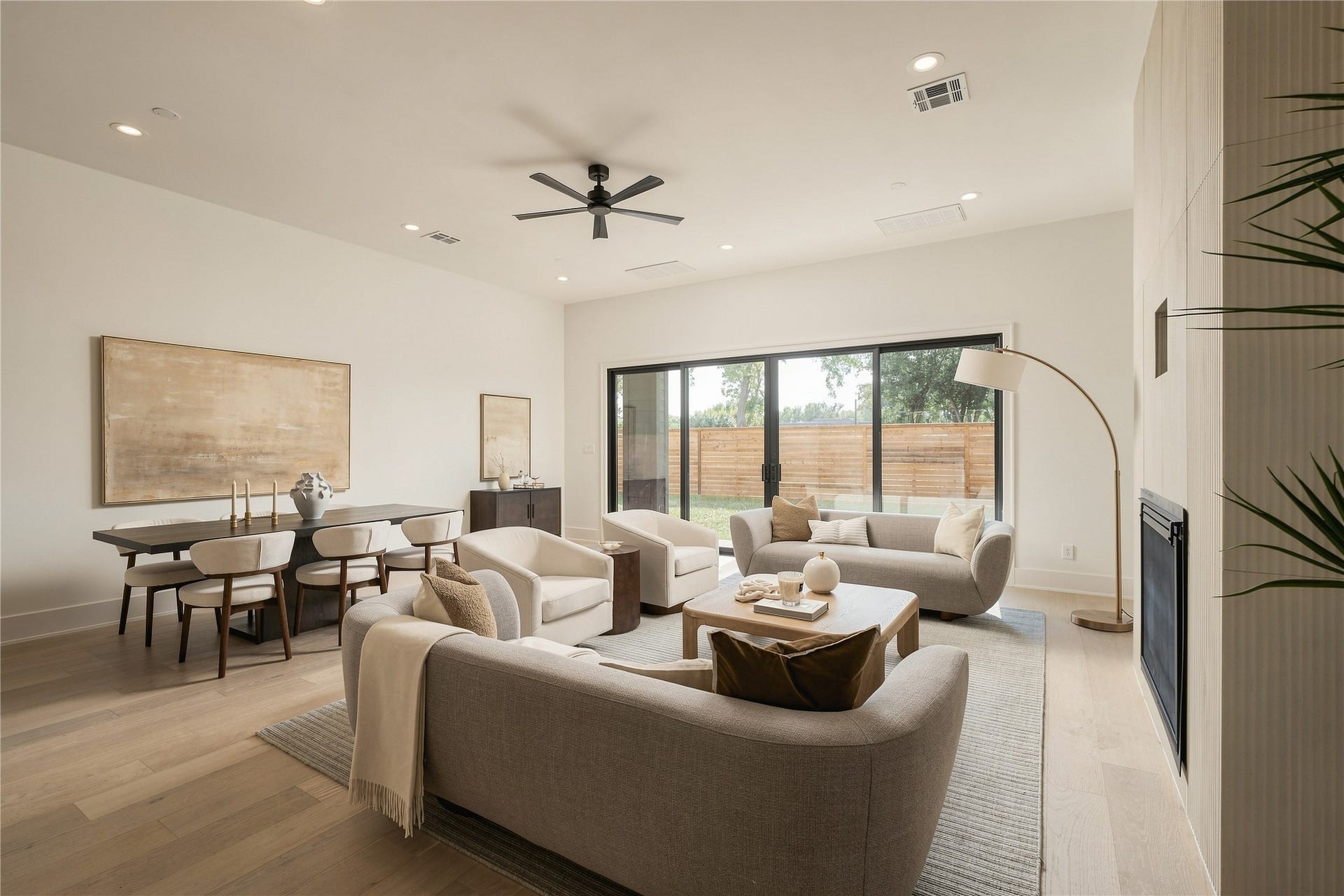 2109 McKean Drive, Houston, TX 77080 The main living room is defined by generous proportions and a gas fireplace, creating a comfortable focal point while maintaining an open connection to the dining and kitchen spaces.
