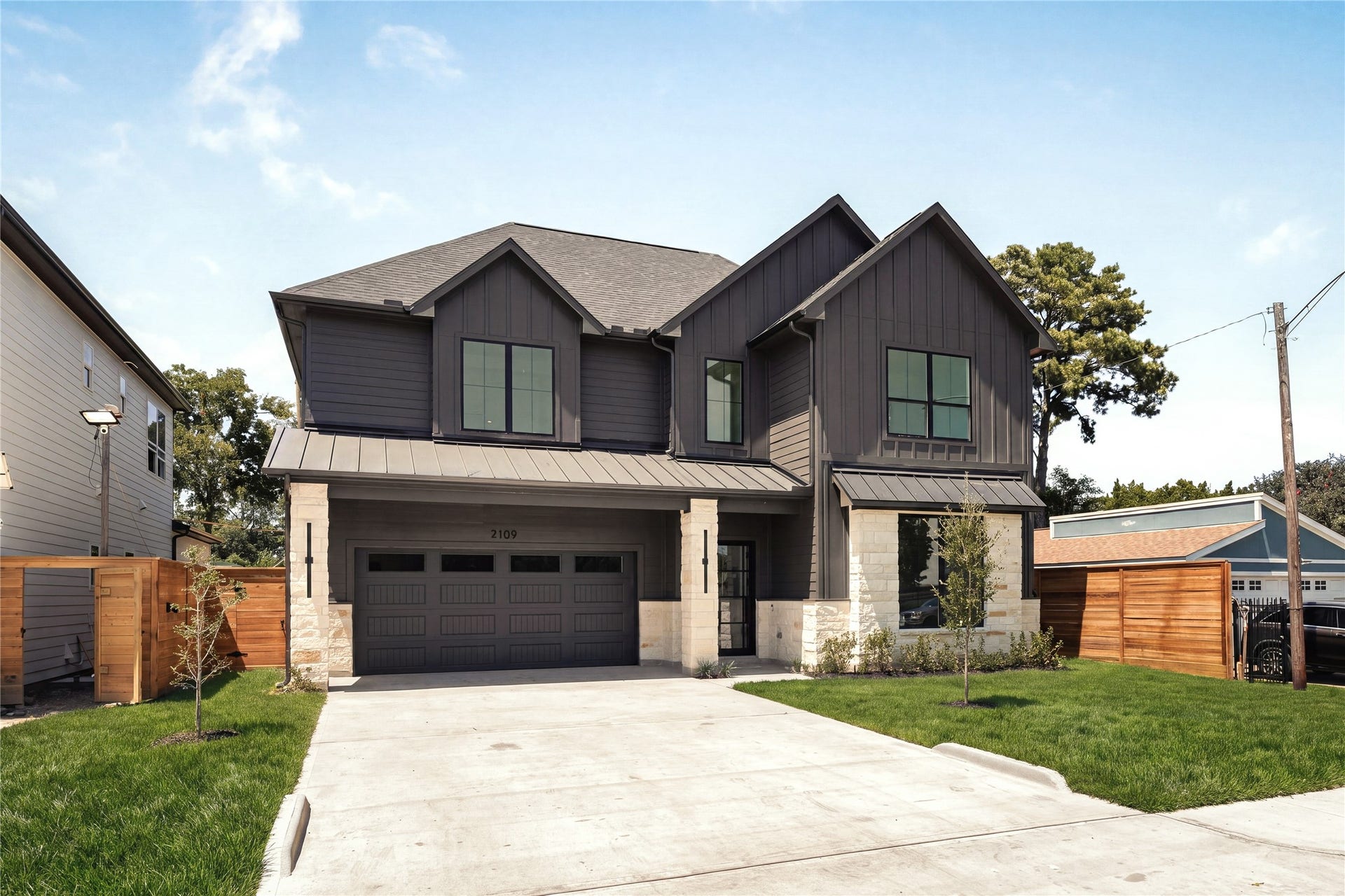 2109 McKean Drive, Houston, TX 77080 Welcome to 2109 McKean Drive, where Nima Homes brings a refined point of view to modern luxury living in Spring Branch, a modern farmhouse masterpiece with an exterior that feels considered from every angle.