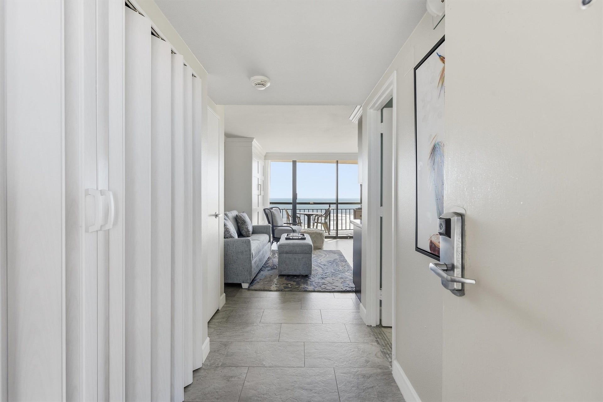 5220 Seawall Boulevard, #1038B, Galveston, TX 77551 A welcoming entry leads to a bright living space with beautiful Gulf views straight ahead.