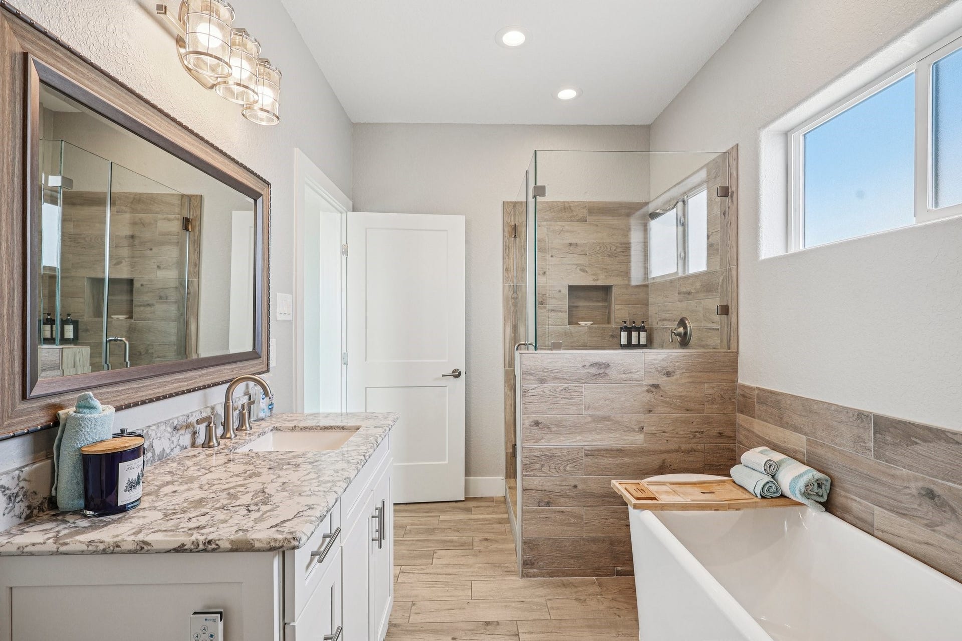 22212 Cantina Drive, Galveston, TX 77554 Elegant bathroom with decorative tub & shower