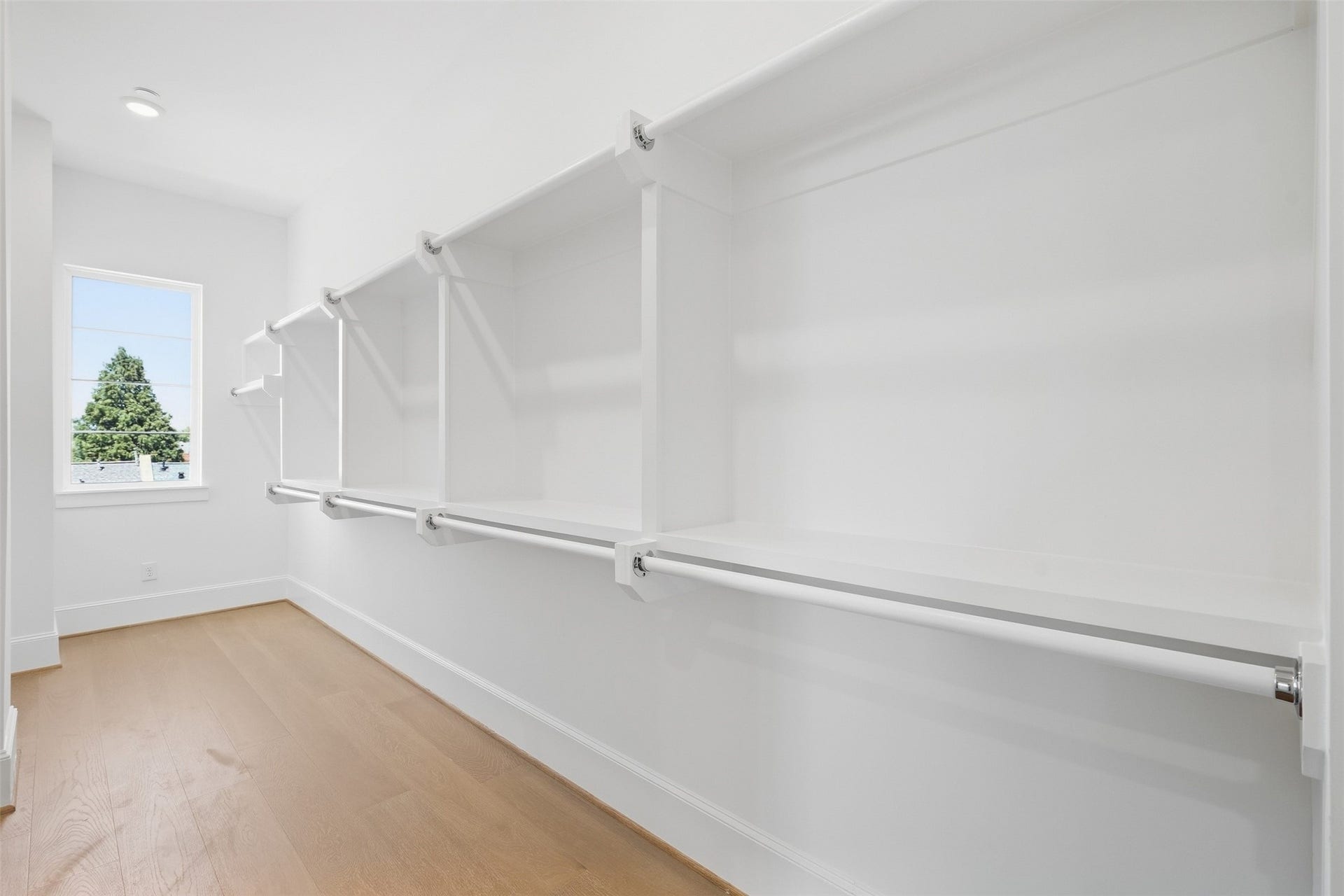 2111 Nantucket Drive, #D, Houston, TX 77057 An oversized walk-in closet provides extensive hanging and storage space, along with natural light for an added touch of luxury.
