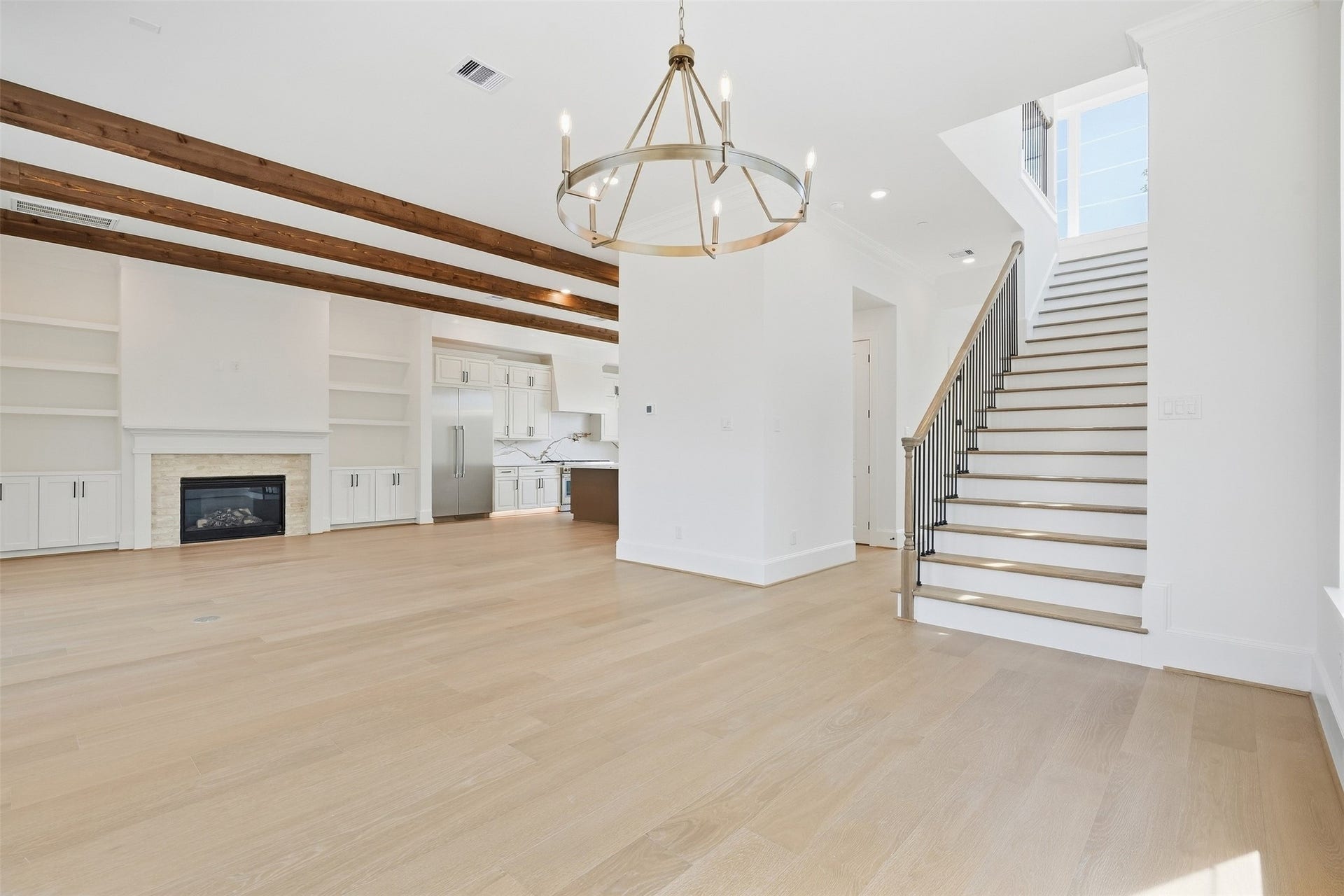2111 Nantucket Drive, #D, Houston, TX 77057 An elegant dining space framed by oversized windows and statement lighting creates a beautiful setting for intimate dinners and entertaining.