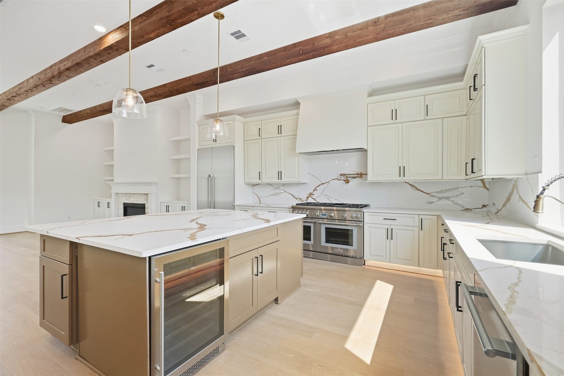 2111 Nantucket Drive, #D, Houston, TX 77057 Designer selections continue throughout the kitchen with statement stone surfaces, custom cabinetry, under-cabinet lighting, and Thermidor appliances.