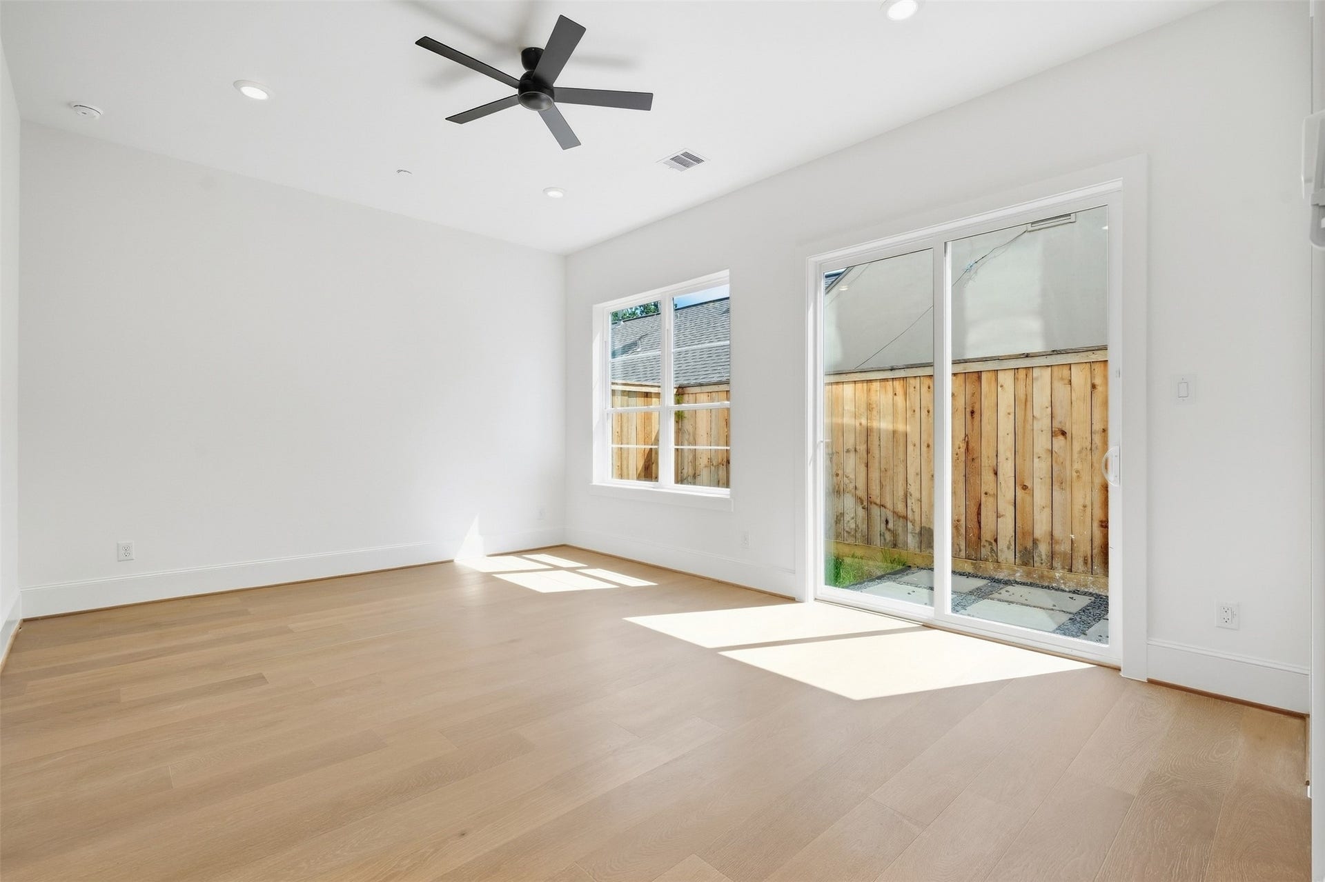 2111 Nantucket Drive, #D, Houston, TX 77057 A versatile first-floor room offers abundant natural light and direct access to the private outdoor patio, ideal as a bedroom, home office, or flex space.