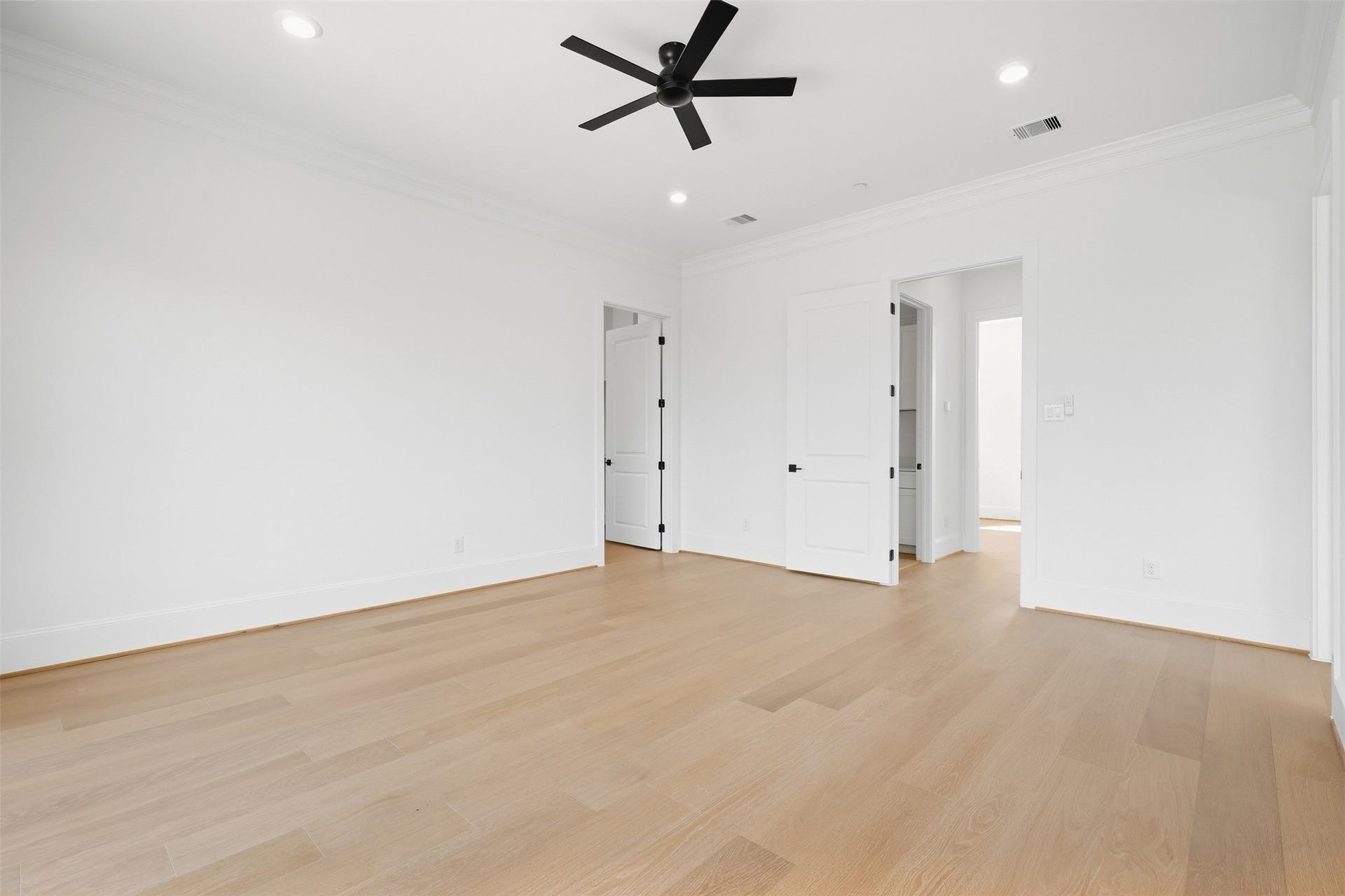 2111 Nantucket Drive, #D, Houston, TX 77057 The primary suite offers a spacious, serene retreat with warm finishes, generous proportions, and an elevated feel throughout.