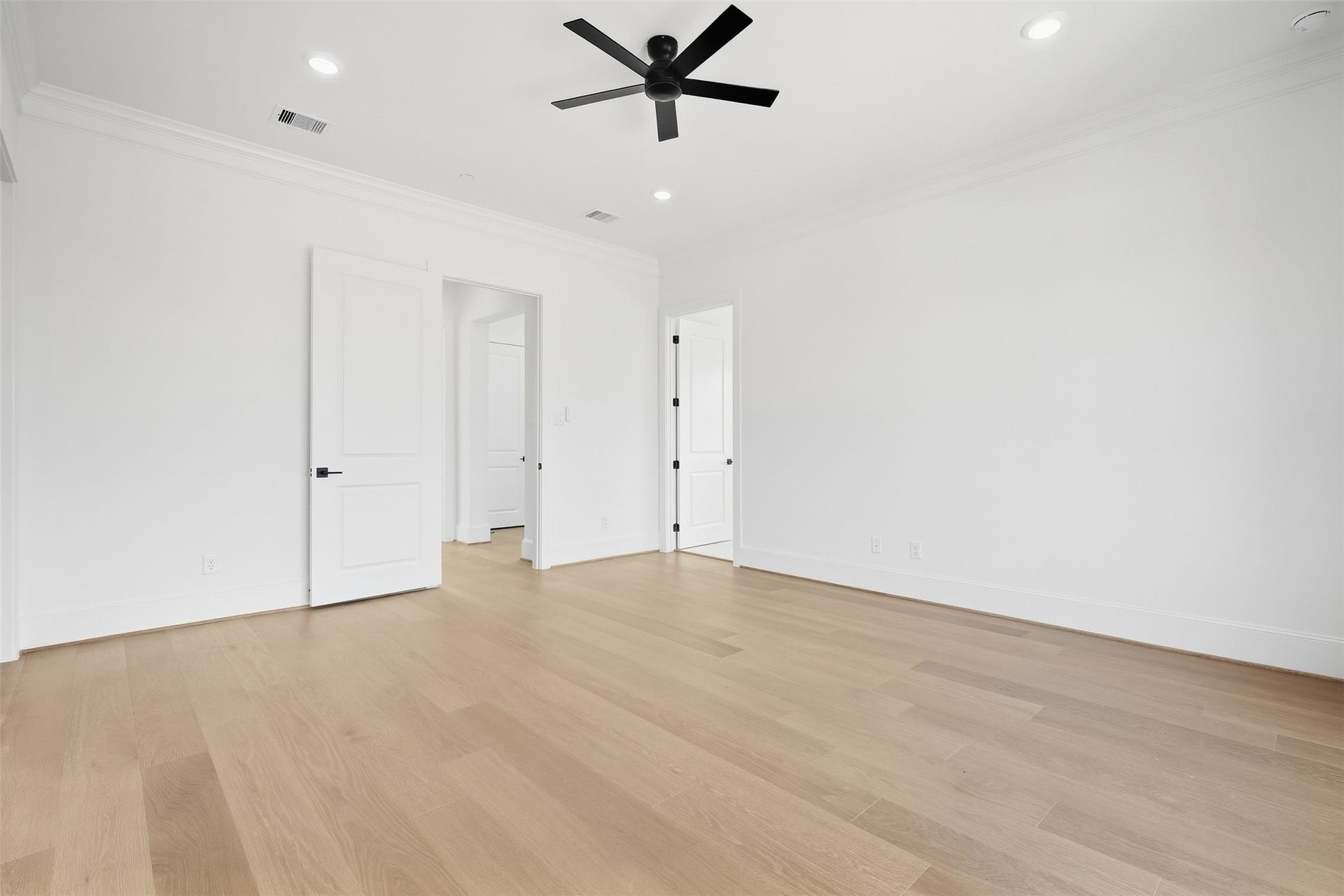 2111 Nantucket Drive, #D, Houston, TX 77057 Another view of the primary suite showcases its impressive scale and thoughtful layout, creating a comfortable place to unwind at the end of the day.