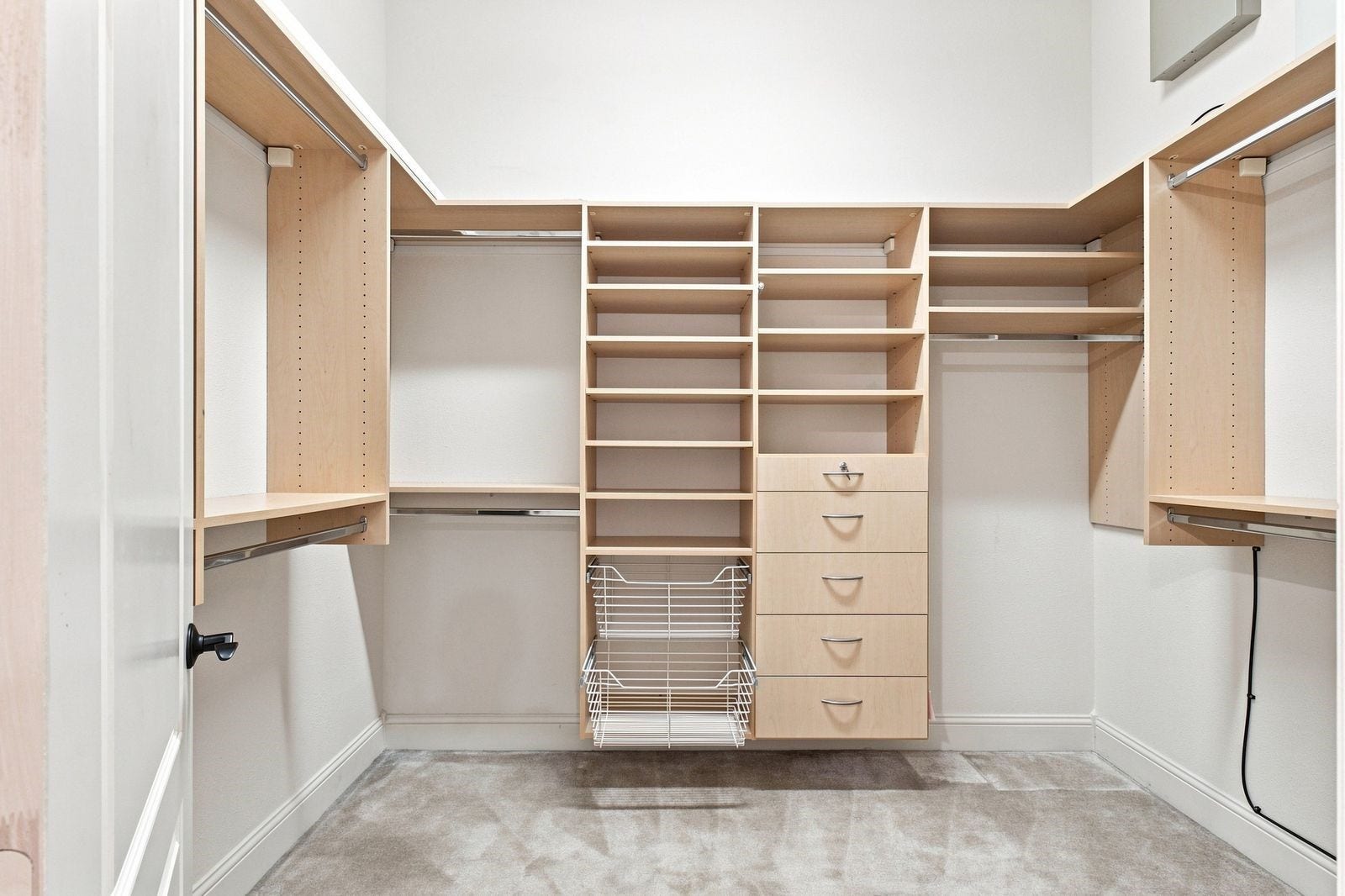 Two separate California style closets! Complete with safes, rods and custom drawers! Closet number 1.