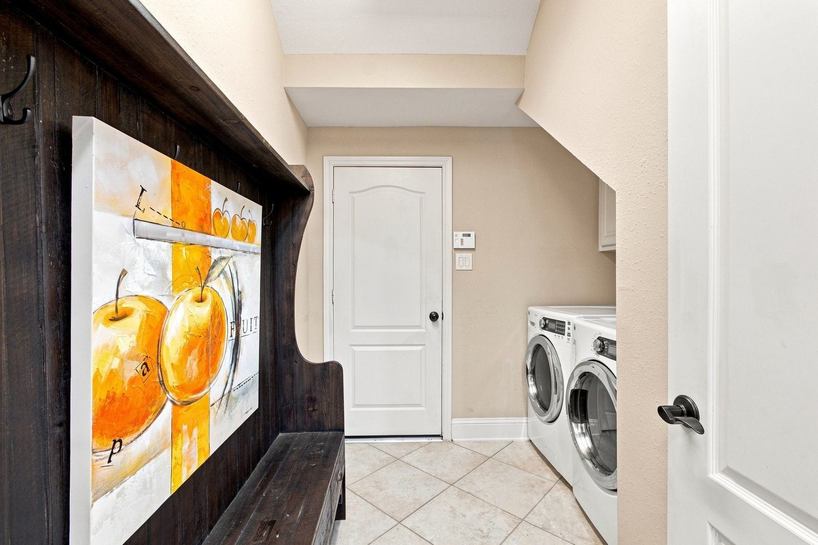 MUD room leading to three car tandem garage - with washer and dryer included!