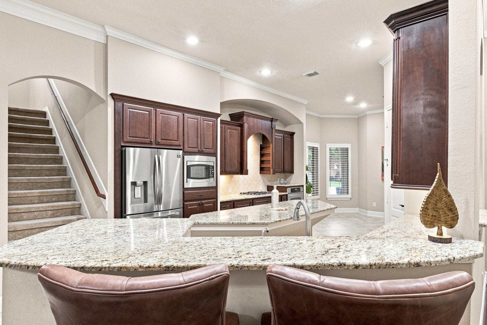 Kitchen overlooks the living room - with bar height counters, perfect for entertaining!
