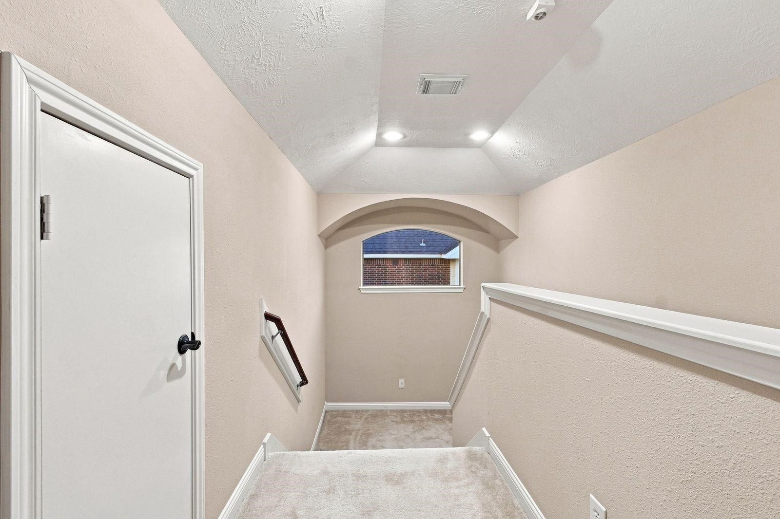 Landing area leading up to the upstairs room.