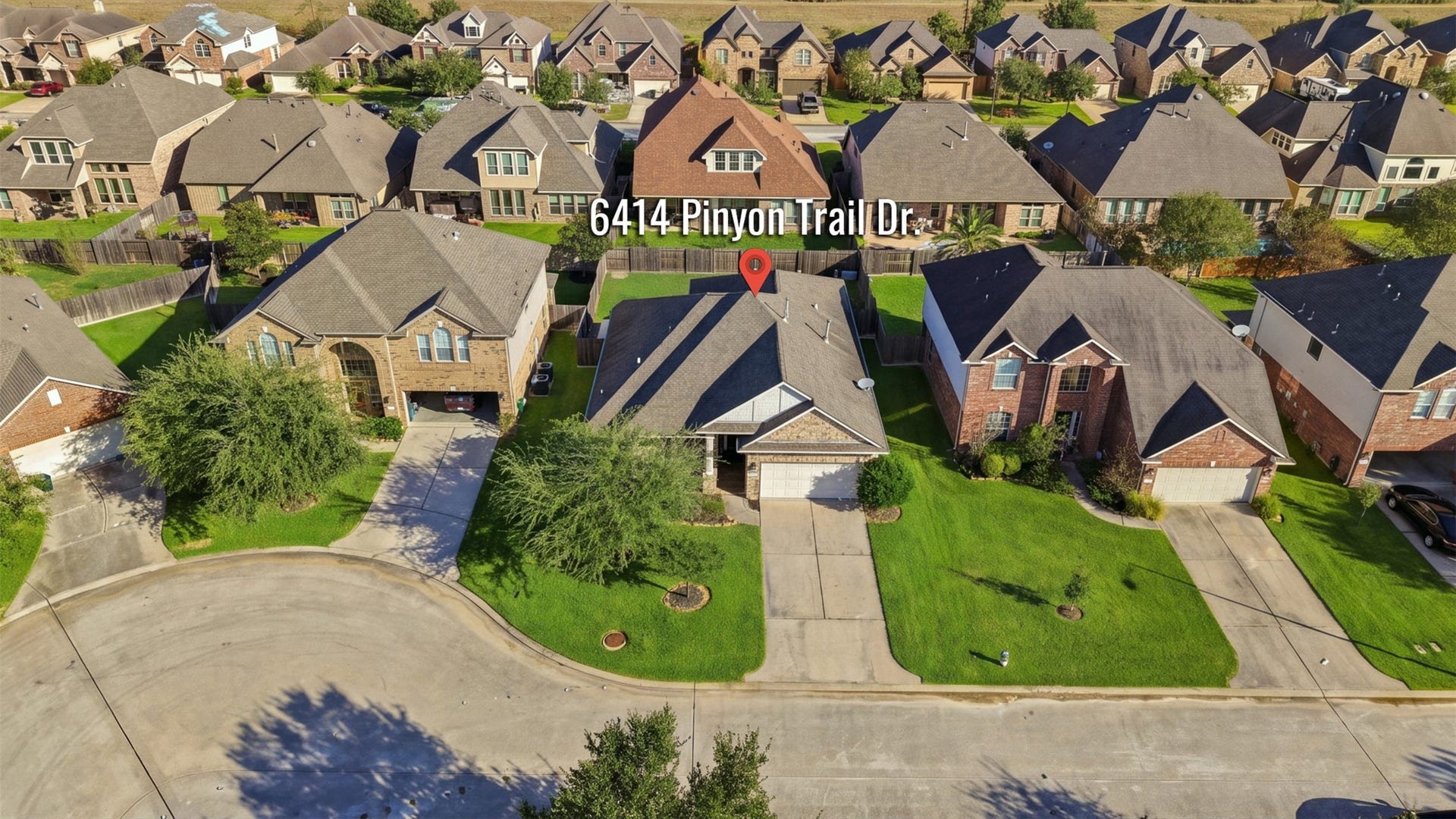 6414 Pinyon Trail Drive, Spring, TX 77389 Enjoy this suburban home with a neatly manicured lawn, spacious driveway, and appealing brick facade, nestled in a well-maintained neighborhood.