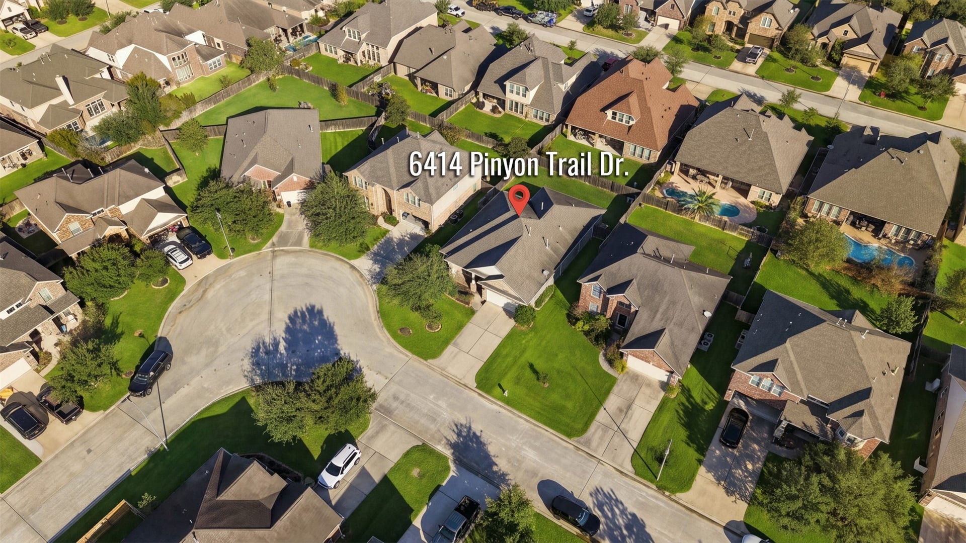 6414 Pinyon Trail Drive, Spring, TX 77389 Lovely home situated in a serene cul-de-sac, surrounded by well-maintained lawns and neighboring houses, offering a peaceful and family-friendly environment.