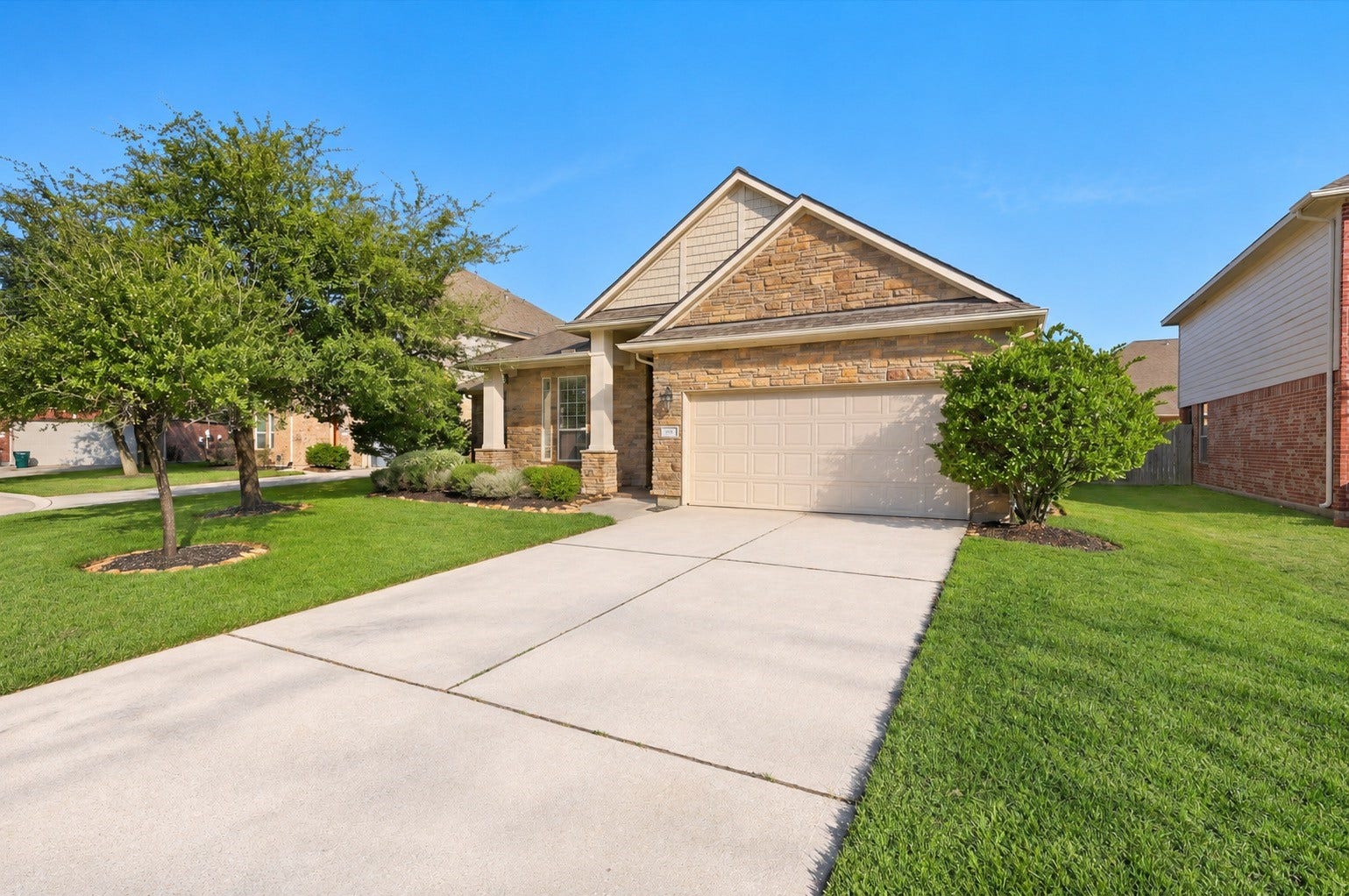 6414 Pinyon Trail Drive, Spring, TX 77389 This single-story home with a stone facade, two-car garage, and well-maintained landscaping, is nestled in the master-planned community of Auburn Lakes.